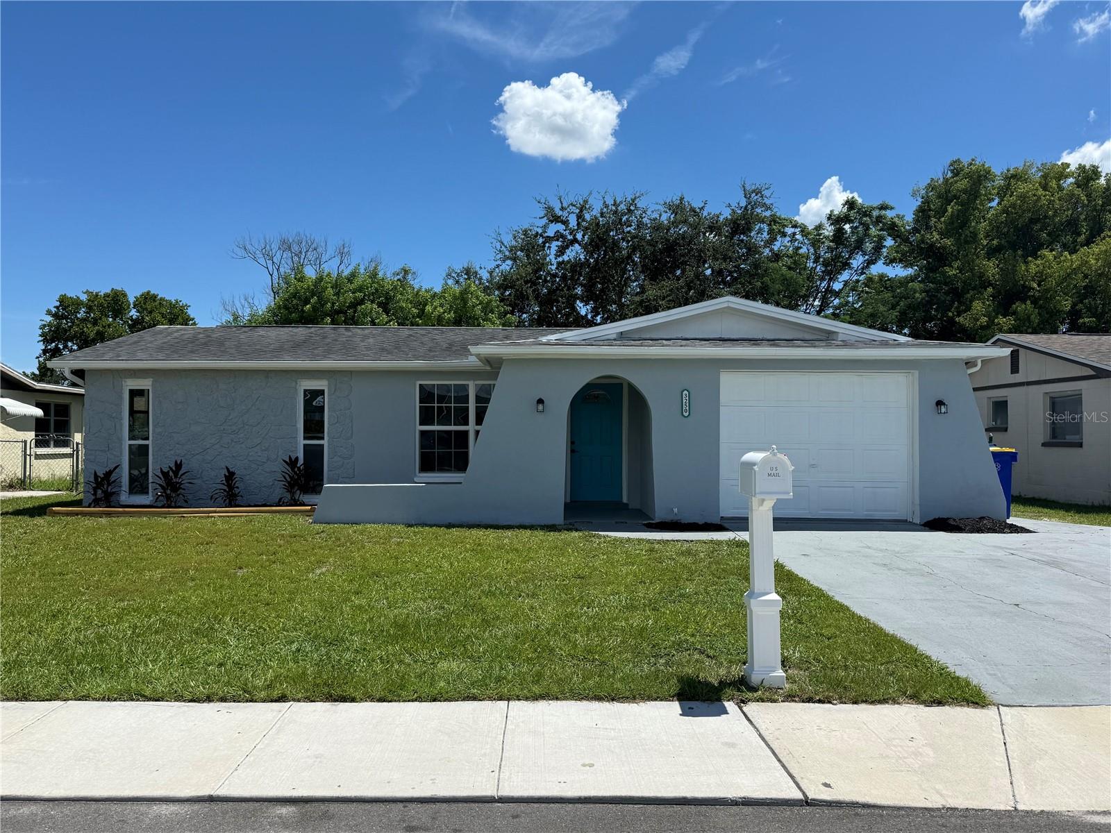 Recently renovated 3 bedroom, 2 bath home with a garage and fenced yard in desirable Holiday Lakes Estates. This home boasts tons of recent updates. Brand new kitchen cabinets with new quartz countertops, new backsplash and new stainless steel appliances. New luxury vinyl plank throughout the property for easy maintenance. New paint inside and out, new modern lighting and ceiling fans, new 6 panel doors, new hot water heater and updated bathrooms along with newer energy efficient vinyl double pane windows. As you enter the front door, you will be greeted by the spacious living room which transitions to a dining area off the kitchen that features brand new stainless steel appliances and recessed lighting. A 30 year dimensional shingle roof was installed 2017 and a new central HVAC 2017, so your major ticket items are taken care of for many years. You have laundry hookups in the garage. Outside you have a nice sized yard out front and you can enjoy your days and evenings in the large fenced backyard along with a little screened porch. The property is located in desirable Holiday Lakes Estates and is just minutes from great restaurants, plenty of shopping, and several beautiful parks and a quick ride to Tampa or the beaches! There is NO HOA, NO Deed Restrictions, and NO Flood Insurance required and has a clean wind mitigation report and 4 point inspection. This home would be great for a 1st time buyer, vacation home, or even move-in ready rental home! Buyer to verify exact room sizes.