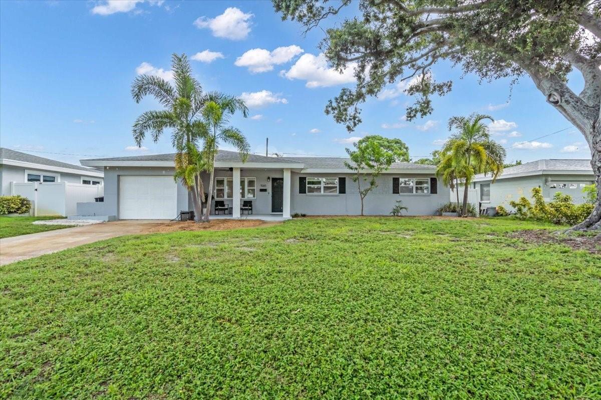 Tucked away on a quiet street in South St. Petersburg, this charming 3 bedroom, 2 bath concrete block home is a perfect blend of timeless craftsmanship and everyday comfort. Just ten minutes to the energy of Downtown and fifteen minutes to the sugar white sands of St. Pete beach. This home sits high and dry—not in a flood zone—within one of the county’s most sought-after school districts. Inside, original terrazzo floors shimmer with mid-century soul, while outside, a nice covered patio and generous yard wrapped in vinyl fencing offers space ample space to entertain large groups. Sip coffee on the welcoming front porch, store your treasures in the 1-car garage, and settle into a home where location, charm, and peace of mind beautifully collide. Call today to schedule your private showing!