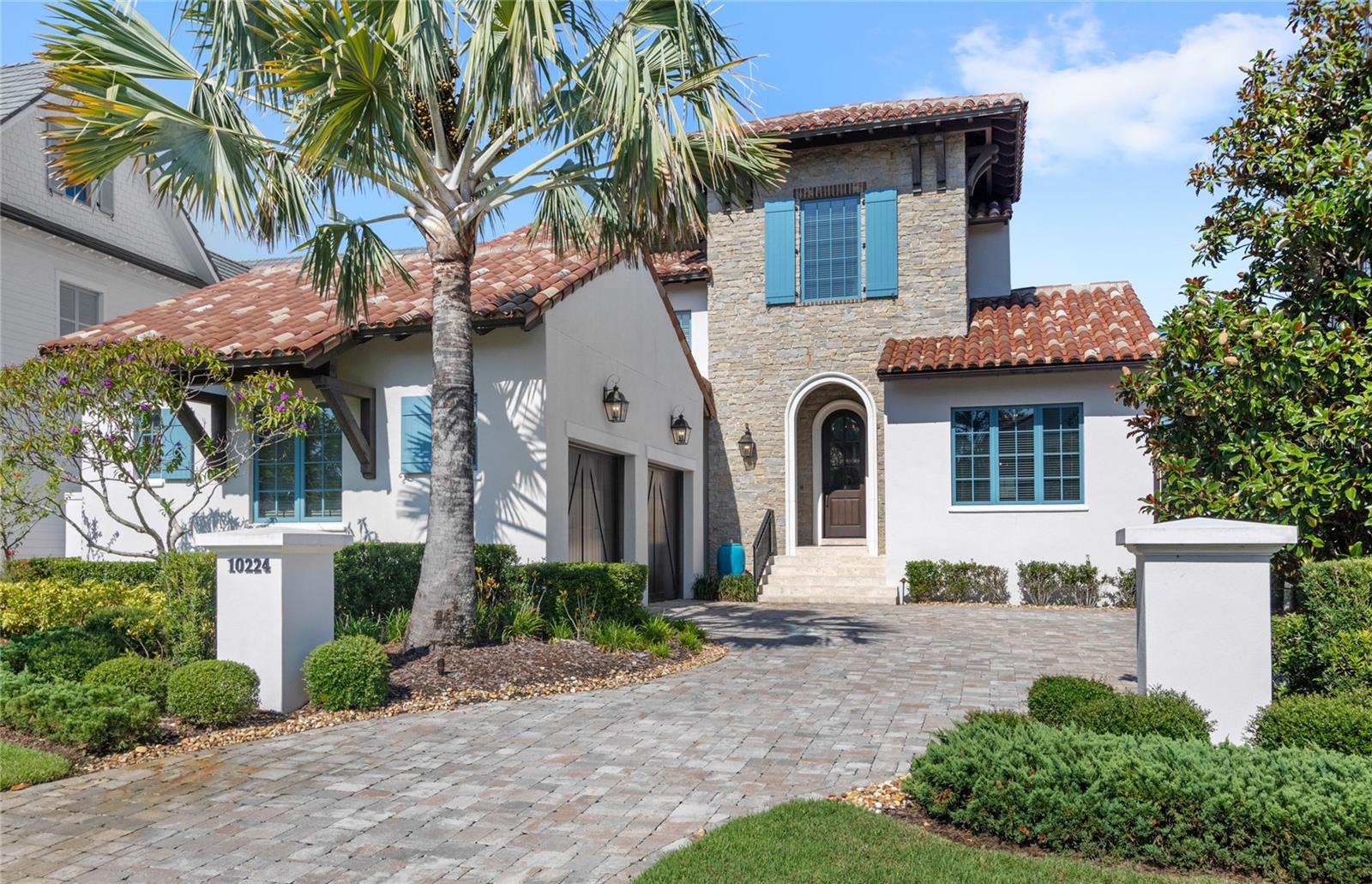 Located deep inside the prestigious Golden Oak neighborhood, "Venice" was built in 2018 by renowned builder ISSA homes as a graceful Spanish-style residence that blends timeless architecture with the magic of Disney living. Designed for both relaxed living and elegant entertaining, the home’s open-concept layout seamlessly connects the great room and gourmet kitchen to a tranquil courtyard and expansive outdoor living space. The first-floor primary suite is a peaceful retreat, complete with courtyard views, a spa-like bath, a large walk-in closet, and a layout that prioritizes both comfort and privacy. Outdoors, a resort-style experience awaits, with a summer kitchen, fireplace, pool, roll-down screens, and spa designed for year-round enjoyment. Upstairs, a spacious loft was thoughtfully imagined as a Jungle Cruise-inspired getaway, offering a whimsical escape that still feels elevated and refined. Offered fully furnished, this home is move-in ready with interiors that complement the home’s architecture and warm, welcoming aesthetic. As part of the Golden Oak lifestyle, residents enjoy exclusive access to Summerhouse, the private clubhouse featuring casual yet upscale dining, a fitness center, resort-style pool, family room, and concierge-level service. Also offered for a one-year lease. Call today for more information or to set up a private tour.