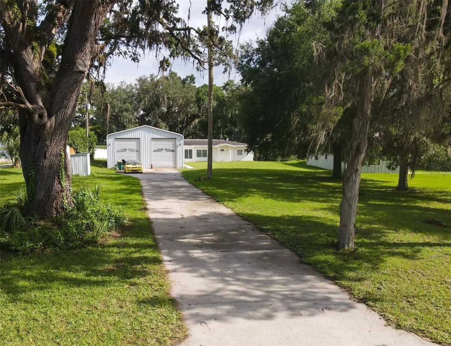 HIGH and DRY ! Situated on nearly an acre (.82 acres), the lot is one of the highest elevation parcels on Lake Henderson — part of the Tsala Apopka Chain of Lakes, known for excellent bass fishing, kayaking, and birdwatching. Enjoy lake views and direct access without the flood concerns common to many waterfront homes.
 Tucked away in nature but just minutes from shopping and dining in downtown Inverness, this well-maintained mid-century home offers the perfect balance of privacy and convenience. Solid construction, a bright and functional layout, and charming original details reflect the pride of ownership throughout.

A 50x30 metal building adds incredible flexibility — use it for secure boat or RV storage, a workshop, studio, or future guest quarters. And with no HOA, the possibilities are wide open.

Recreation is right around the corner with the scenic Withlacoochee State Trail nearby — 46 paved miles of biking, walking, or jogging through Florida's most charming landscaping and historic towns.  

Whether you're looking for a peaceful full-time residence, vacation home, or potential Airbnb investment, this property offers an unbeatable combination of location, land, and lifestyle. Bring your kayak, bring your vision  this is Florida living at its best.