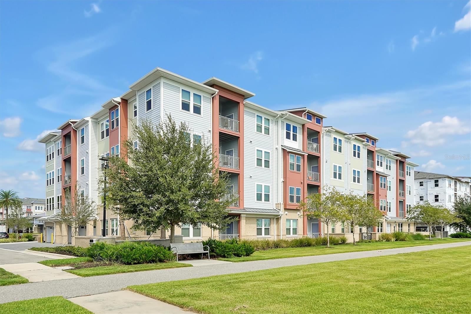 Welcome to The Gatherings of Lake Nona, a premier 55+ active adult community. This stunning third-floor condo offers two spacious en suite bedrooms, two baths, a private balcony, central elevator access, and a 1-car garage attached to the building. Built in 2022, the open layout seamlessly blends the kitchen, dining, and living areas—perfect for everyday living or entertaining.
The kitchen is a standout feature with granite countertops, a sleek breakfast bar, stainless steel appliances, and ample cabinetry. Step onto your private balcony and enjoy serene views—ideal for morning coffee or evening unwinding.
Beyond your front door, world-class amenities await: a resort-style pool, fire pit, outdoor kitchen and grill, tennis and pickleball courts, and more. Every detail is designed to enhance your lifestyle.
These homes are ENERGY STAR® certified, Indoor airPLUS qualified, and built to exceed energy code standards—offering both comfort and efficiency.
Located near Lake Nona Town Center and just minutes from Orlando International Airport, this is the low-maintenance lifestyle you’ve been waiting for. Come experience it for yourself—schedule your private tour today!