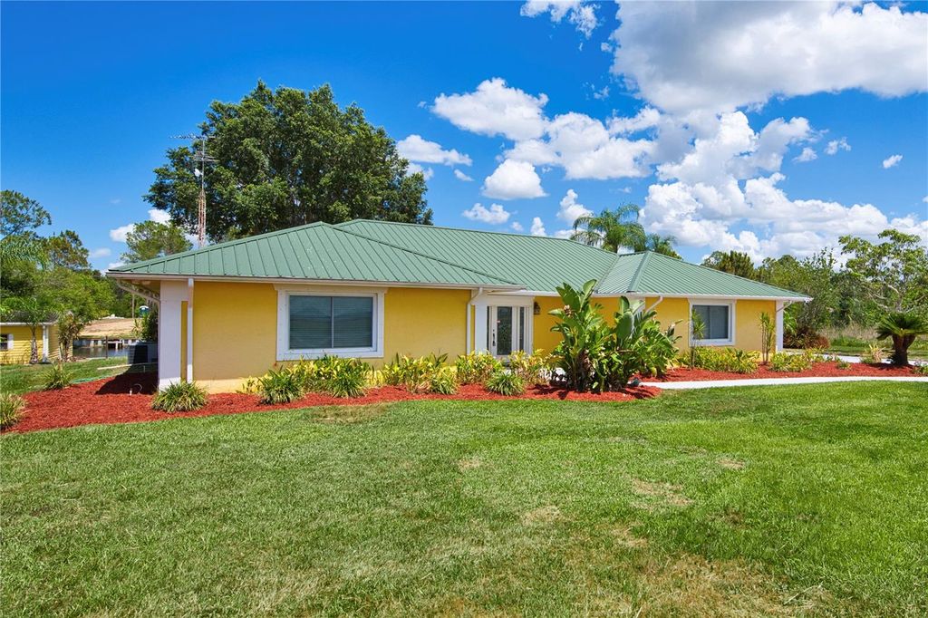 Photo of 6589 Banyan Drive, Indian Lake Estates, FL 33855 (MLS # TB8370890)