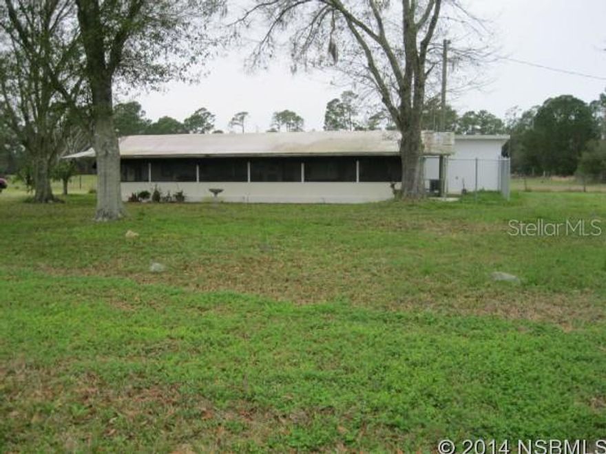BRING THE RV, BOAT, MOTORCYCLE, HORSES, COWS, CHICKENS OR JUST BRING YOURSELF TO ENJOY THIS OWNER BUILT VERY INTERESTING HOME WITH 5 ACRES OF CLEARED LAND.  TRANQUILITY IS THE KEY WORD FOR THIS PROPERTY. THE HOME HAS A 200 MPH NASA APPROVED HURRICANE CURTAIN FOR THE FRONT PORCH TO ENSURE YOUR SECURITY.  3 BR 2 BATH WITH EAT IN KITCHEN COMBINED WITH AN L SHAPED FORMAL LIVING AND DINING ROOM. IN ADDITION TO THIS YOU HAVE A 12 X 28 FT FLORIDA ROOM FOR YOU TO RELAX AND ENJOY AND WATCH YOUR FAVORITE TV PROGRAMS.   COME AND SEE THIS UNIQUE HOME DOWN ON THE FARM. A 30 X 45 FT POLE BARN AND A STAND ALONE 2 CAR GARAGE ARE ALSO INCLUDED.METAL STORAGE BUILDINGS DO NOT CONVEY
