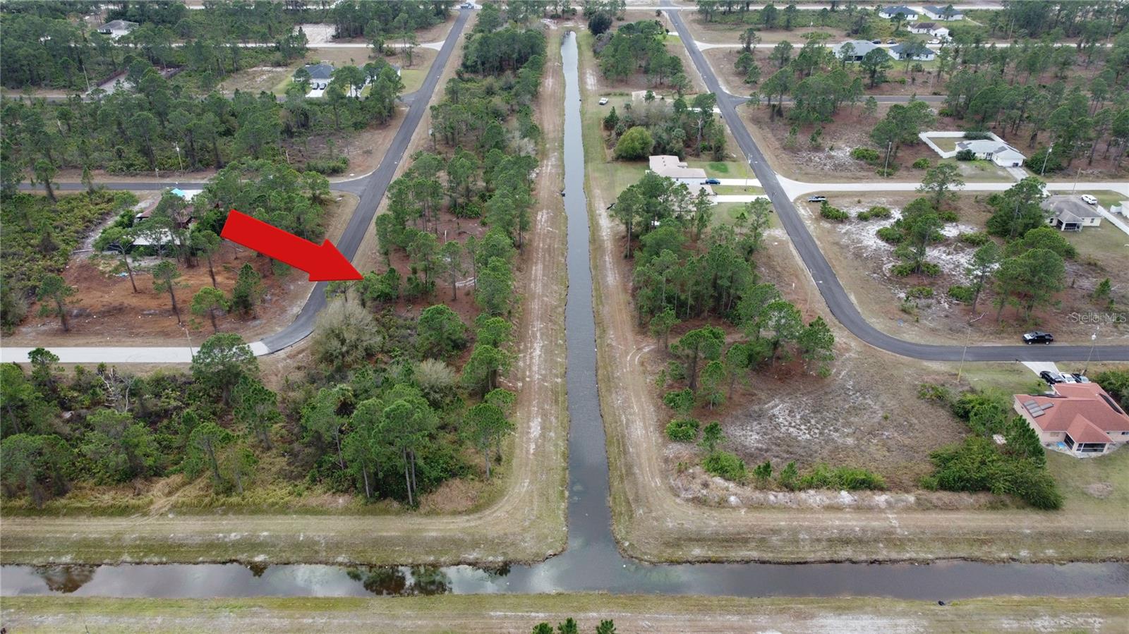 This lot backs up to a canal in the rear with a large easement that also creates a larger land area! Enjoy a rarity in Lehigh Acres with having a canal in your backyard to have a little Florida water oasis. Quiet street off the main roads mean little to no thru-traffic! Nice country feel while still being close to all the amenities you need! Not far to grocery stores, and other amenities. Major airport just a quick drive away (RSW Southwest International Airport), as well as other adventures to explore: Fort Myers Beach, JetBlue Stadium (Home of the Red Sox spring training), Hammond Stadium (Home of the Twins spring training). Activities nearby include Lehigh Acres Community Park North; Lehigh Acres Trailhead Park; Lee County Manatee Park offering waterfront park providing paved trails, up-close views of manatees, an amphitheater & kayak rentals; Caloosahatchee Regional Park with sprawling, nearly 770-acre park featuring trails for mountain biking & hiking plus campsites & more. Not to mention the many beaches just West! SW Florida living is truly paradise! Reserve your piece of paradise in the Sunshine State today while prices are still affordable.