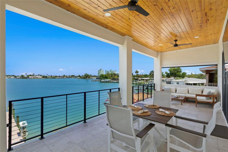 Live like you're on vacation everyday in this amazing 2021 construction home on Beautiful Boca Ciega Bay and over 5600 sq ft under roof! So many thoughtful details resonating throughout, you'll love them all! The interior spaces are generous, the outdoor spaces are tremendous and the surrounding area creates a perfect place for Fun with Family and Friends. If you are looking for that unique coastal living experience, this home is a must see. Pride of ownership is apparent the moment you walk into this stunning home.  The light bright and inviting floor plan allows for water views, dual primary suites on 1st and 2nd living floors, elevator, whole house generator, and so many attributes we prepared a full page list! The outdoor space is truly exceptional; over 1300 sq ft of covered outdoor space, relaxing spa,  newer seawall, 2021 dock with full electric/water, a 7K lb boat lift help create the ultimate outdoor living experience. Are you are a "cook your catch" off of the dock fishing enthusiast or an avid boater seeking easy access and no bridges to the Gulf of Mexico, this home has it all! With over 1500 sq ft of garage space, there's plenty of room for cars, golf carts, bikes, boat gear and more!  Wake each morning to our fabulous sunrises, take an easy stroll to downtown Historic Corey Ave to enjoy Sunday morning market, great dining and fun shops.   Easy access to vibrant Downtown St Petersburg to enjoy trendy restaurants, visit acclaimed museums or to catch a Rays or Rowdies game. Quick drive to Tampa Int'l or St Pete/Clearwater Airports, makes business or casual travel a breeze. Whether you choose to walk, bike or take the golf cart, there are so many fun things to do!