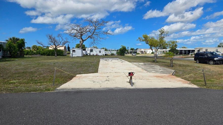 This is a great place to make you new home. This oversized lot in Holiday Mobile Estates offers you as little or as much as you would like.  There is a very active club (Edgewater) with a heated and clilled swimming pool, club house with many, many activities, tennis, pickleball, shuffleboard plus more.  The Gulf of America is only three mile away with four beautiful beaches.  Near buy there is shopping, restaurants, medical facilities, golf courses, boat launches, fishing and the list is endless.  Hope to see you soon.