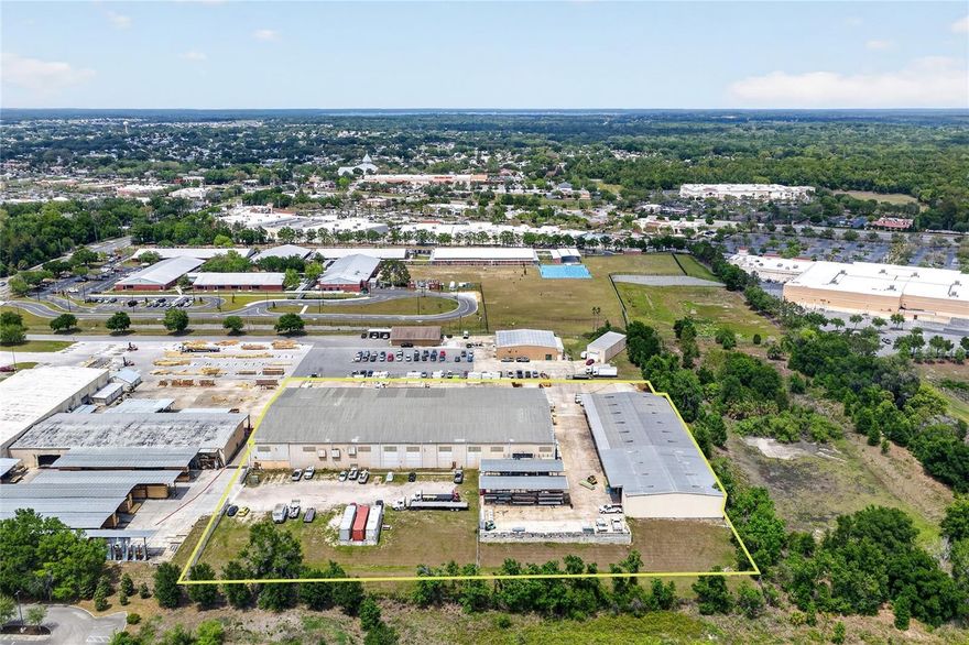 Rare Industrial/Light Manufacturing Building for Sale in Lady Lake bordering The Villages.  This Industrial Facility consists of 2 Buildings totaling 62,420 +/- Sq. Ft..  Building 1 is 42,900 +/- Sq. Ft. and Building 2 is 19,520 +/- Sq. Ft..  The buildings sit on 4.57 +/- Acres and housed a large Lumber & Building Supply Company for many years.  Building 1 has six (6) 18’w x 15’h grade level doors.  Building 2 has three (3) 20’w x 14’h  curtain doors of which one of these doors has a loading dock and two are grade level doors.  There is main power servicing the Building(s) of 480v / 3 Phase currently.  Building 1 has 3,554 +/- Sq. Ft. of office space and Building 2 has 1,132 +/- Sq. Ft. of office space.  Great location and great opportunity.