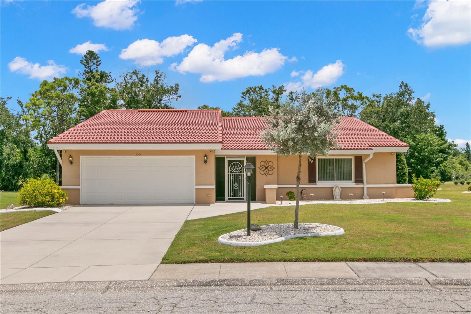 Welcome to the #1 Rated Retirement Community in America, Sun City Center! This golf cart friendly community boasts a variety of recreational and social activities, perfect for enjoying year-round living. With over 100 clubs available, there is something for everyone! This Sahara II floor plan is situated on a generous CONSERVATION lot, spanning one-third of an acre, and offers privacy with no backyard neighbors. The OVERSIZED CONSERVATION lot, combined with a luxurious tile roof and meticulously and easily maintained landscaping, gives this home a welcoming curb appeal that invites you to explore the interior! Completely UPDATED, this home has 2 bedrooms, 2 bathrooms and a bonus room that is currently being used as an office. Elegance and comfort blend seamlessly with a GREAT ROOM that includes a kitchen with TIMELESS finishes including CUSTOM designed wood cabinetry with soft close, dove tail doors and drawers, crown molding and light rail. The countertops are made of CAMBRIA® Quartz, which beautifully complements the neutral backsplash. Plus, the appliances are LG Stainless Steel including a French door refrigerator which allows for easy storage. The island is GRAND and offers additional storage and seating for FOUR comfortably and ideal for informal meals and entertaining. Step outside to enjoy the screened and covered lanai, which has an elevated ceiling height. You'll discover a rich variety of lush, tropical plants, such as the stunning Bird of Paradise, all while overlooking the private backyard. Here, you might catch a glimpse of local wildlife, including different species of birds. Back inside, this split floor plan has the primary bedroom at the rear of the home. This spacious room easily accommodates large furniture without feeling cramped, and three windows flood the area with ample natural light. A spacious walk-in closet separates the en-suite bathroom that features a Corian® countertop with an integrated sink for easy cleaning. The walk-in shower has been UPDATED with tile that extends from floor to ceiling and has convenient niches for shampoo and soap. The secondary bedroom is spacious, featuring two built-in closets and a furniture niche complete with a window. With convenient access to the second full bathroom, your guests will appreciate the modern updates, including shower tiles adorned with listello banding in the tub and shower combination. Additionally, the Corian® countertop features an integrated sink for added style and functionality. Laundry becomes a more enjoyable task in this space that features a closet for storage, shelves to neatly organize your items, and a NexStyle® utility sink! The Seller is offering for sale their E-Z-GO 48 Volt Golf Cart that has 6 new batteries! Additional features and updates include a tile roof that was installed in 2014 and has Pro-Kleen fungicide professionally applied twice a year which keeps the roof looking brand new year-round! The HVAC system was installed 12/2018 and has a Brand New UV Light and coils recently replaced, Level 4 Porcelain Glazed Tile installed offset in all the main living spaces and wet areas, upgraded carpet in the bedrooms, newer Double-Pane windows with Low-E windows throughout, new blinds (2022), Whole House Florida Water Treatment System with Autotrol Valve, Night Owl Protect System with NVR with 7 cameras (Cat 5), Whole House Attic Antenna, Sprinkler is on well water, newly painted and repaired curbing and the garage door has hurricane bracing!