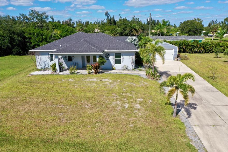 Welcome to Your Punta Gorda Paradise! Experience the perfect blend of comfort, elegance, and Florida living in this beautifully designed 2-bedroom, 2-bathroom home spanning 1,400 square feet. Built in 2019 on a triple lot (18,021 sq ft total), this property offers the space, privacy, and peace of mind you’ve been searching for. Perched on high ground and untouched by the storms of 2024, this home delivers both security and serenity in one of Punta Gorda’s most sought-after settings. Step inside and be greeted by vaulted ceilings, stylish tile flooring throughout, and fixtures that exude modern sophistication. The open-concept layout creates a light and airy flow, enhanced by hurricane-impact windows that invite an abundance of natural light while keeping you safe and sound. The spacious primary suite is your personal retreat—featuring sliding doors that open to the oversized, screened-in lanai where you can unwind and enjoy the evening breeze. The luxurious ensuite bath includes a dual-entry walk-in shower with Dual showerheads for a spa-like experience. Entertain or relax in the expansive screened and covered lanai, complete with beautiful tile flooring and accessible through triple sliding glass doors. This seamless indoor-outdoor connection is perfect for gatherings, alfresco dining, or simply soaking up the Florida sunshine in total privacy. An irrigation system that can keep your lush landscaping in pristine condition year-round. Location couldn’t be better — just minutes from downtown Punta Gorda’s charming shops, fine dining, and waterfront activities. Travel is effortless with Punta Gorda Airport only 5 minutes away, and Southwest Florida International Airport (RSW) in Fort Myers just a 40-minute drive. Quick access to I-75 makes exploring all of Florida a breeze. Love the outdoors? The Darst Boat Ramp is right down the street, offering easy access to Charlotte Harbor and the Gulf of Mexico, and golf enthusiasts will enjoy a different course for every day of the week within 30 minutes. This home truly offers it all — luxury, safety, and an unbeatable location — making it one of the most desirable finds in Punta Gorda. Don’t miss the chance to make this remarkable property your forever home or seasonal retreat!