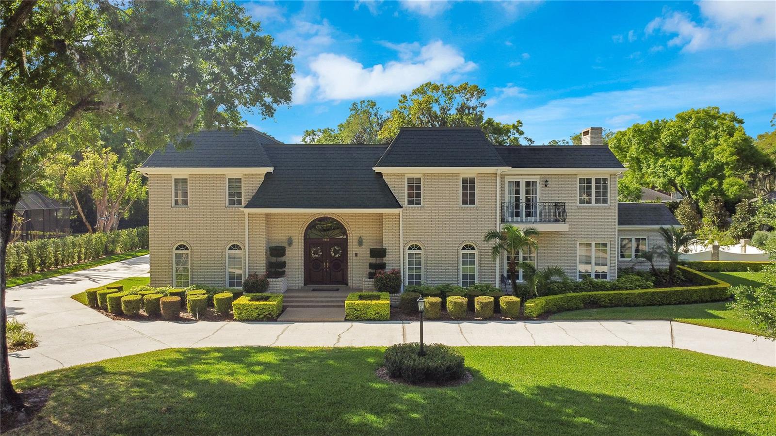 Elegant Lake Hollingsworth Estate Home! This stunning property boasts 5 bedrooms, 5.5 bathrooms, and has been meticulously maintained by its sole owner. Just steps away from the picturesque Lake Hollingsworth, this residence offers a wealth of amenities. Inside, you'll find a formal dining room, formal living room, family room, dinette space, an office, and not one, but two laundry rooms for added convenience. The spacious, well-appointed kitchen is a chef's dream, featuring granite countertops, solid wood cabinetry, a center island with cooktop and ample storage, stainless steel appliances, and a breakfast bar for casual dining. Retreat to the luxurious master bedroom, complete with a walk-in closet and a luxury master bathroom that offers a large step-in shower and sunken garden tub. Summers are meant to be enjoyed poolside, and this home delivers with a covered, fully enclosed patio overlooking a generously sized pool and spa. The lush backyard is surrounded by a concrete border, ensuring privacy, while its immaculately tended landscaping creates a tranquil oasis. Perfectly situated in the highly sought-after Lake Hollingsworth area, this home offers convenient access to all amenities that Lakeland has to offer.