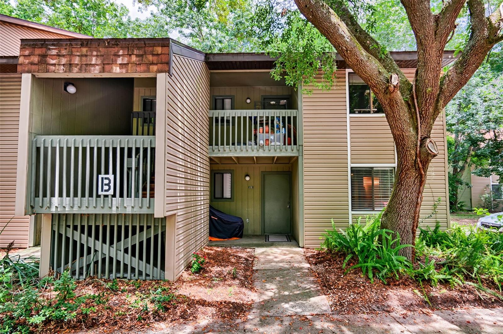 Move in ready with washer/dryer in unit! This beautiful condo at Treehouse Village condominiums boasts of many upgrades. The kitchen has been fully renovated with quartz countertops, solid wood soft-close cabinets and all stainless steel appliances. The stove, microwave, kitchen faucet and washer/dryer were all replaced in 2024. Easy upkeep with absolutely no carpet throughout the condo with luxury vinyl plank in the bedrooms and common areas with tile in the kitchen and bathrooms. This condo is perfectly designed for roommates as each bedroom has its own private bathroom and the common areas consist of the living room, dining, kitchen and washer/dryer closets. B101 is located in a quiet location of the property where there is no through-way traffic, surrounded by nature and it's less than 2 miles to the University of Florida, half a mile to grocery and convenience stores and less than mile from Downtown Gainesville. Come check out this turnkey condo today!