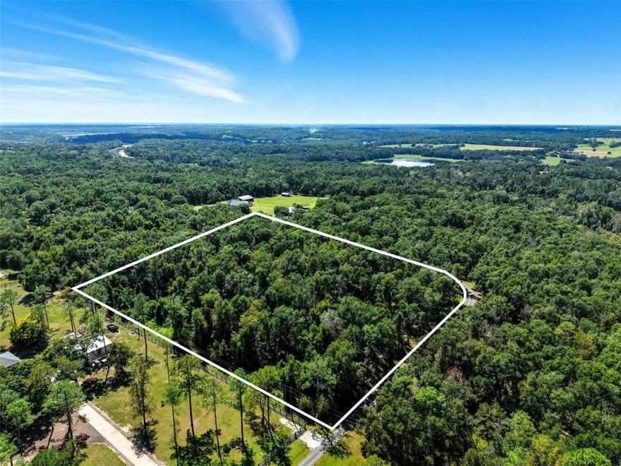 Welcome to The Plateau, where peace and acreage take center stage. This 5.10-acre corner homesite on a private paved road offers room to breathe 222,156 sq ft (nearly four football fields!). Set your residence far off the road with a long, meandering driveway, create generous buffers from neighbors, and still have ample space for outdoor living, gardens, a pool, and your equestrian lifestyle—bring your horses! The community’s loop layout has only two nearby entries, keeping through-traffic to a minimum and preserving the quiet, private feel you’ll love. Enjoy “country-calm, city-close” convenience—45 minutes to Tampa International Airport and ~25 minutes to Tampa Premium Outlets, The Shops at Wiregrass, Costco, Sam’s Club, and dining. Low HOA: $250/year. If you’ve been waiting for acreage that truly feels private, this is it.