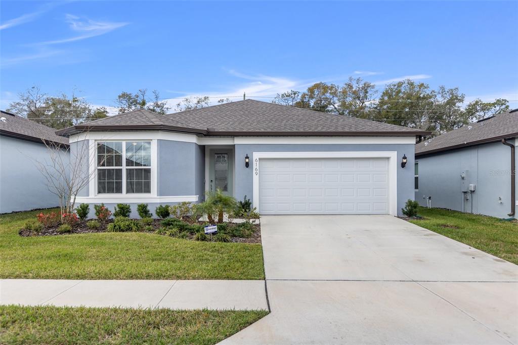 Don't wait for a home to be built! This beautiful home is a three bedroom/2 bath built by Pulte in 2021 with upgrades. The subdivision is gated and located near Silver Oaks golf course, shopping and medical facilities. As you enter the home from the covered entrance you are welcomed to a wider hallway. Two bedrooms and a hall bath are to your left. Further down the hall is the indoor laundry and entrance to the double car garage. Shelving has been built in the garage for extra storage Continuing down the hall leads to the open concept with the living, dining and kitchen. The living has a wall with sliders overlooking the screened back porch. The kitchen has an island with a sink in it overlooking the living area so you are a part of the family activities. Appliances are stainless stell. The dining room also has a slider leading to the back porch. The master suite has a walk in closet and en suite. The bath has a walk in shower and dual sinks. The back yard has been fenced for pets and family. There is a solar system to help with the electric bill. Don't let this one get away. Call for an appointment now to view this welcoming home with upgrades.