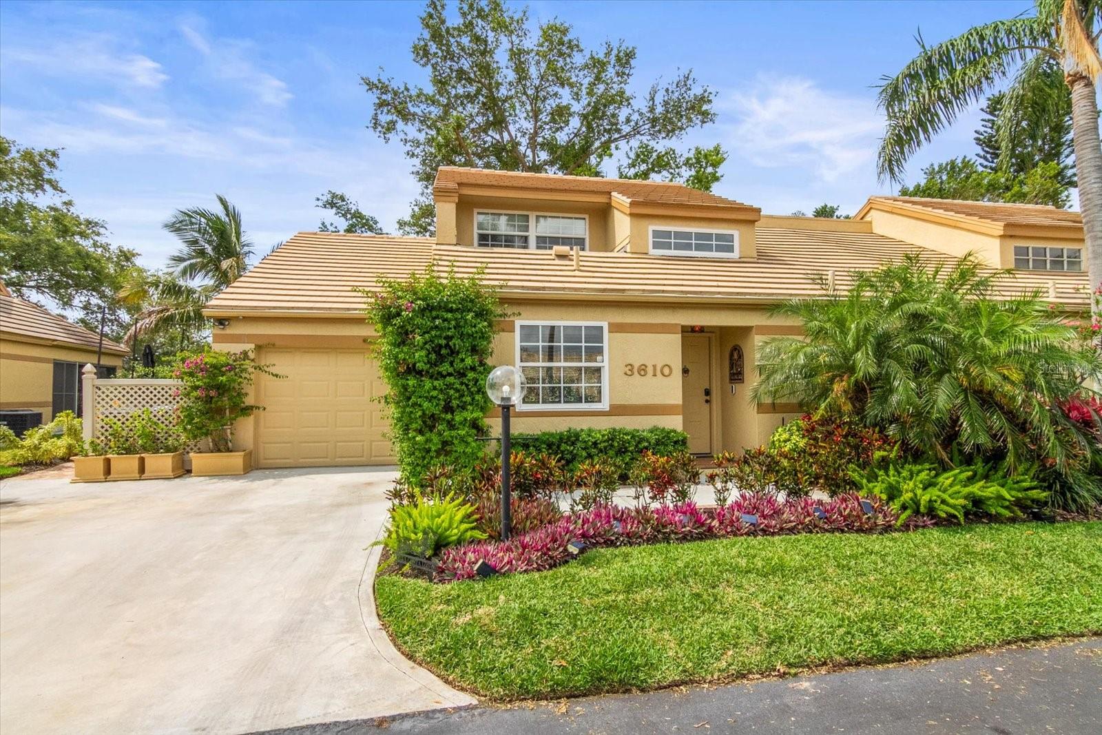 Welcome to this stunning upgraded gated community townhouse close to IMG Academy - where luxury, comfort and style come together in perfect harmony. From the moment you step inside, you'll be captivated by the rich hardwood floors, elegant Hunter Douglas window treatments and sophisticated louvered doors that enhance every room. The heart of the home is a chef's dream: a custom designed kitchen with premium cabinetry, sleek Carrera marble countertops, and top of the line appliances - ideal for both everyday living and effortless entertaining. This beautifully appointed three-bedroom, two-bath residence offers thoughtfully updated bathrooms featuring Kohler fixtures and timeless design. The spacious primary suite is located on the main level, offering tranquil pond views and direct access to lush, mature landscaping. Step outside to your private paved oasis featuring pond views, fountain and a firepit, perfect for unwinding or hosting guests in style. The home has a new HVAC (2025), PGY hurricane windows, 2018 tile roof and underlayment, expanded sunroom, 2 car driveway, recessed lighting, fans and much much more. The community features a clubhouse, two pools and tennis courts for you to enjoy. Fantastic location just minutes from IMG Academy, IMG Golf and Country Club, restaurants and shopping. Short drive to downtown Sarasota and beautiful Anna Marie Island beaches.