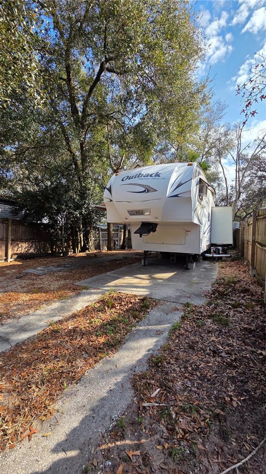 Cozy one-bedroom mobile home on a fee-simple lot at Clarcona Resort—perfect weekend getaway or full-time slice of Florida living. Unit 554 sits on a compact size 0.05 pad (about two thousand square feet) with 37x71 foot dimensions—plenty of room for your RV, grill, and a couple chairs. Built-in hookups, water/sewer, trash, and gated security all covered in the $283 monthly HOA.
Inside: one bedroom, one bath, open kitchen-living combo—fresh paint, newer flooring, and that classic resort vibe. Walk to the pool, clubhouse, and shuffleboard in minutes. No land lease drama—just own it outright. Priced to move—ideal for snowbirds or first-timers. Call today before it’s gone!"