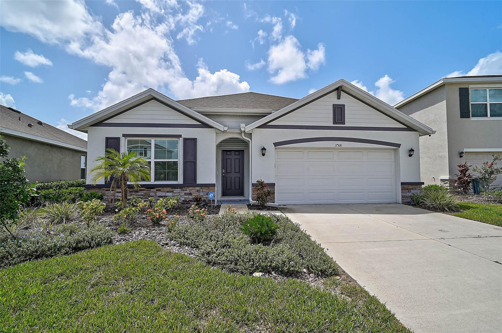 Welcome to this stunning, like-new home in the sought-after community of Solera at Lakewood Ranch! Built in 2023, this immaculate 4-bedroom, 2-bathroom residence offers a perfect blend of modern comfort and style. You'll love the spacious 2-car garage with an epoxy-sealed floor and the added convenience of full rain gutters around the exterior.
Step inside to discover a thoughtfully designed interior featuring luxury vinyl tile flooring in all bedrooms—no carpet here, just a few tasteful throw rugs for added comfort. The kitchen is a showstopper with its sleek tile backsplash, modern appliances, and open layout ideal for entertaining.
Outside, your own private oasis awaits. Enjoy year-round relaxation in the heated, saltwater pool and spa, all overlooking a peaceful pond view that adds tranquility to everyday living.
Solera residents enjoy access to fantastic community amenities, including two playgrounds and a resort-style pool with plenty of lounge seating and a covered pavilion available for private parties and gatherings.
This home is truly move-in ready—spotless, stylish, and set in a thriving neighborhood with top-rated schools, parks, and shopping just minutes away. Don’t miss your chance to live the Florida lifestyle you’ve been dreaming of!
