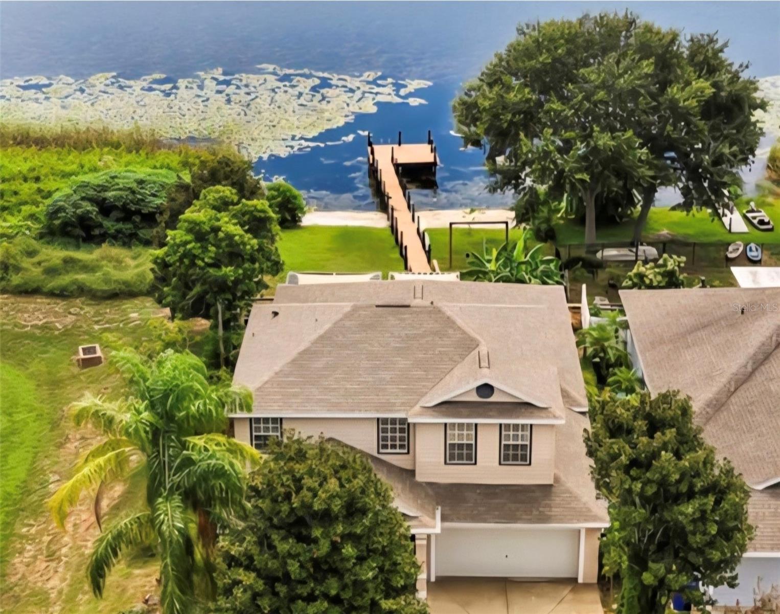 Modern Lakeside Sanctuary
Nestled on the serene shores of one of Central Florida's most beautiful lakes, Lake Saunders, which allows skiing and boating , this stunning 4 bedroom 2.5 bathroom two-story home offers the perfect blend of modern luxury and relaxed, lakefront living sitting at the end of the cul de sac. You can have lakefront without the need for flood insurance! Located in Tavares, the "Seaplane City," this property is a haven for those who love water views, boating, and sunsets.
The home has impressive interior contemporary coastal design. The exterior is updated with a fresh, neutral color palette. The rear of the home is where it truly shines, featuring a massive lanai and a spacious open deck that provides uninterrupted, panoramic views of the lake. A brand new private dock extends over the water, offering direct access for your boat, jet skis, or simply to fish and enjoy the tranquil water. The playground for little ones is a beach like delight. The spa on the deck allows relaxation for the adults with a view.
Step inside to discover a bright and airy open-concept layout where the family room, dining area, and gourmet kitchen flow seamlessly together, all oriented towards the breathtaking lake views. The heart of the home features high ceilings, and views galore that flood the space with natural light, and elegant luxury vinyl plank (LVP) flooring that runs throughout the main living areas. This home has no carpet.
This home enjoys a premier location in Tavares, a vibrant city known for its seaplane base and chain of lakes. It's just minutes from downtown Tavares' restaurants, shops, and events, and offers easy access to major highways for a commute to Orlando (approx. 45 minutes) or other parts of Central Florida. It’s a paradise for outdoor enthusiasts, with endless opportunities for boating, fishing, and water sports right from your backyard.
This property is more than a house; it's a modern, low-maintenance lifestyle opportunity where every day feels like a vacation on the water. This one is a must see.
