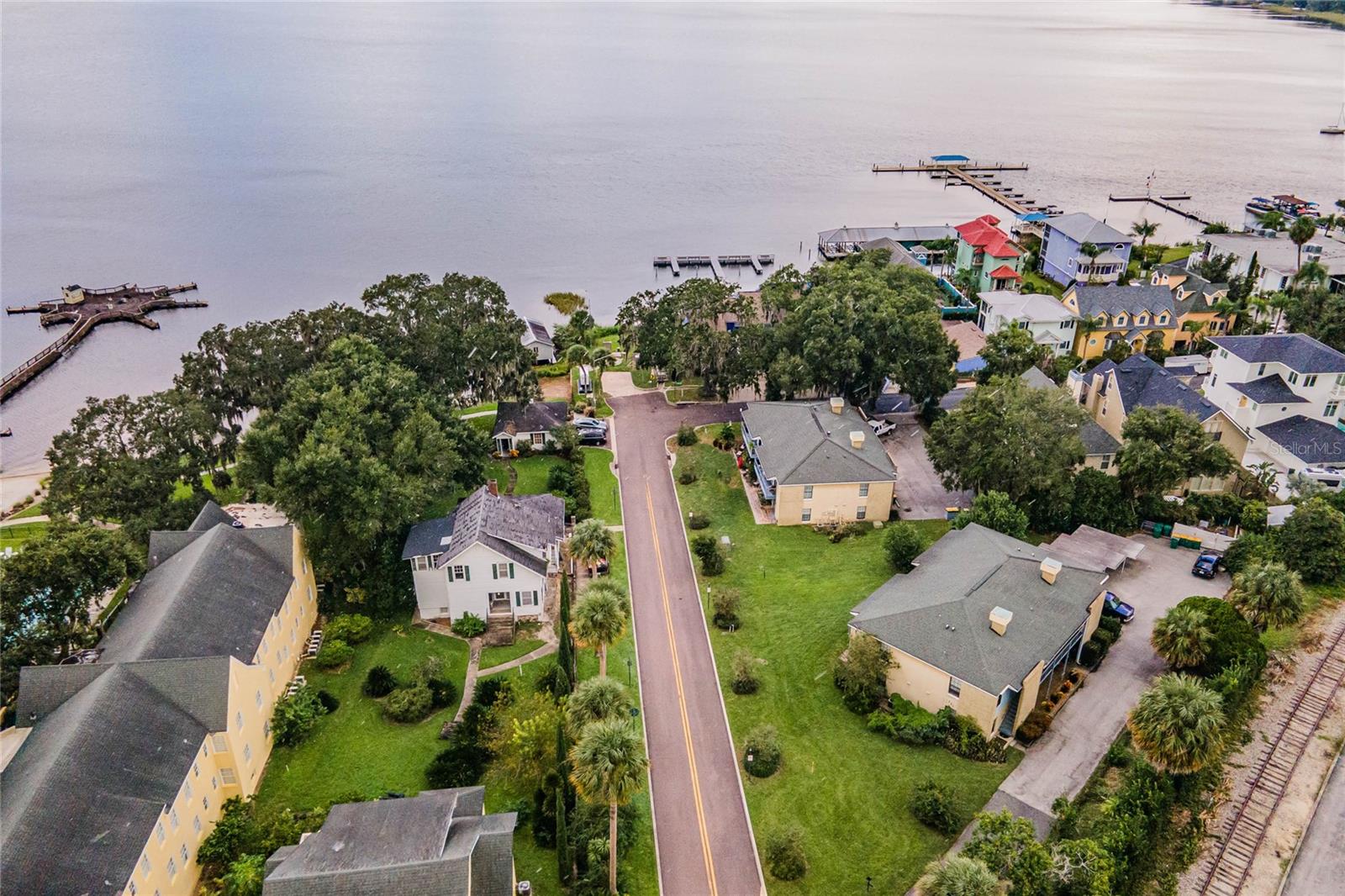 Cash Flowing Multi-family Opportunity in Historic Downtown Mount Dora! Don’t miss this unique opportunity to own historic downtown charm steps from the lively downtown scene. Your tenants will enjoy views of Lake Dora and be steps away of all the exciting downtown activities. Mount Dora’s growing entertainment & business district makes this property perfect for long- or short-term rentals. The complex is across the street from the Lakeside inn, the Olive Branch, and Magical Meat Boutique restaurants. The property features 2 buildings with 2 units upstairs and 2 units downstairs for a total of 4 units per building. The East building includes an attached carport with one space for each tenant. Each unit features an open living concept with a kitchen, dining room, living room, 2 bedrooms, 1.5 baths, walk-in closets, a laundry room, and a back porch to enjoy their view. The layout of all the units matches the layouts of the units in the pictures. Call today to take advantage of this exciting opportunity to own a part of Mount Dora's history and be a part of Mount Dora's future!
