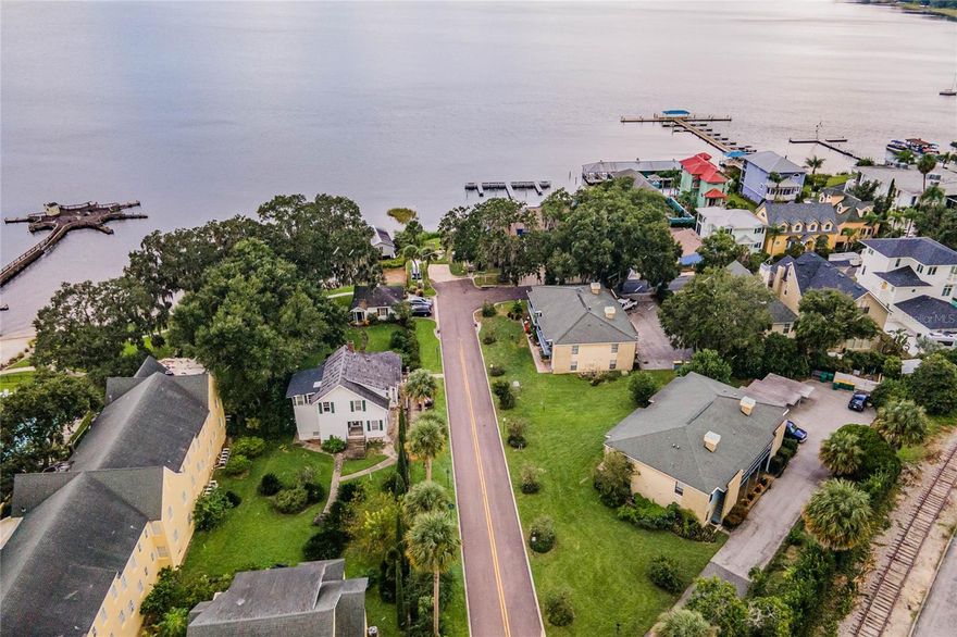 Cash Flowing Multi-family Opportunity in Historic Downtown Mount Dora!  Don’t miss this unique opportunity to own historic downtown charm steps from the lively downtown scene. Your tenants will enjoy views of Lake Dora and be steps away of all the exciting downtown activities. Mount Dora’s growing entertainment & business district makes this property perfect for long- or short-term rentals. The complex is across the street from the Lakeside inn, the Olive Branch, and Magical Meat Boutique restaurants. The property features 2 buildings with 2 units upstairs and 2 units downstairs for a total of 4 units per building. The East building includes an attached carport with one space for each tenant. Each unit features an open living concept with a kitchen, dining room, living room, 2 bedrooms, 1.5 baths, walk-in closets, a laundry room, and a back porch to enjoy their view. The layout of all the units matches the layouts of the units in the pictures. Call today to take advantage of this exciting opportunity to own a part of Mount Dora's history and be a part of Mount Dora's future!