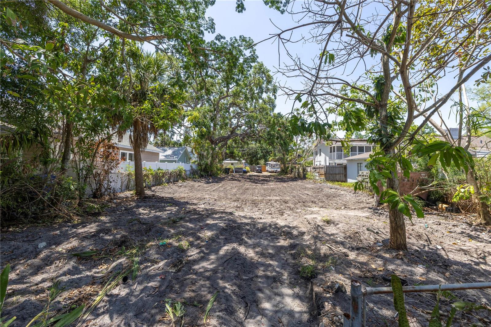 Rare Opportunity in Historic Old Southeast – Vacant Lot Ready for Your Dream Home! Welcome to one of St. Petersburg’s most charming and sought-after neighborhoods—Old Southeast, where historic character meets modern convenience. This cleared and build-ready 50' x 140' lot offers the perfect canvas to design and build your custom home with the builder of your choice. Situated on a picturesque brick street with granite curbs and sidewalks, this homesite is framed by beautiful mature trees that add natural beauty and shade. With alley access at the rear of the property, you have flexibility for garage placement and an Accessory Dwelling Unit (ADU)—a valuable option thanks to favorable zoning. Enjoy the best of both worlds: a peaceful residential setting within walking distance to Lassing Park’s waterfront views, and just minutes to vibrant downtown St. Pete, its award-winning restaurants, cultural attractions, and beaches. This is a competitively priced opportunity to invest in one of the city’s most beloved historic neighborhoods. Whether you're dreaming of a classic bungalow or a modern retreat, this lot is ready for you to bring your vision to life. Don’t miss your chance to create something truly special in a location that blends charm, convenience, and community.