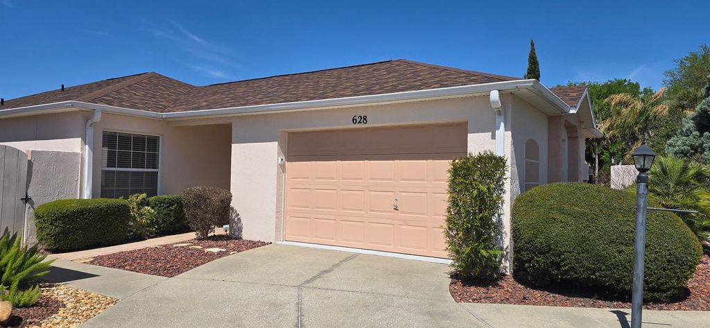 Photo of 628 Dominguez Drive, Lady Lake, FL 32159 (MLS # OM722943)