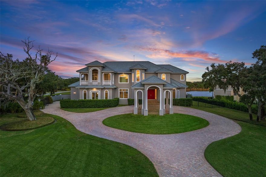 Welcome to waterfront luxury living in the prestigious community of West Shore at Tierra Verde! Nestled in one of the most coveted waterfront estate neighborhoods in Tampa/St. Petersburg area, this magnificent residence boasts over 5800 square feet of pure opulence. As you enter through the brick-paved circular driveway, the grandeur of this home becomes immediately apparent. The 21' high ceilings of the grand foyer create a dramatic entrance, offering breathtaking views that await through the window walls. Situated on nearly an acre, this home is adjacent to a private nature preserve recognized by the Audubon Society, ensuring a blend of luxury and natural beauty. The main level seamlessly connects sun-drenched living, dining, and family rooms around the expansive kitchen adorned with high-end appliances. A private office with a half bath and a bedroom with a full ensuite bath on the first level provide both space and privacy, with captivating views of the outdoors. Ascend the beautiful staircase with a custom bannister to discover the expansive owner's suite. This retreat includes a private, large lanai – the perfect vantage point for enjoying stunning Gulf sunsets. The ensuite bathroom features a jetted tub, dual vanities, a spacious shower, and a walk-in closet. Two additional bedrooms on the second floor, each with a private lanai, ensuite baths, and generous walk-in closets, offer comfort and tranquility. Entertainment knows no limits in this home – from movies in the 13-seat private theater to revelry in the massive ultimate game room, and a personal gym for your daily workout needs. Step outside to a paradise of leisure, where a beautiful pool and spa await adjacent to over 2000 square feet of patio and entertaining space. Beyond, a lighted, full-sized basketball court beckons for friendly competition. This home ensures every form of entertainment and enjoyment for its discerning owners. Discover all that the Tierra Verde community offers, including a marina, public boat ramp, fishing piers, golf course, restaurants, and bike trails to Fort DeSoto. With proximity to Tampa International Airport, award-winning Gulf beaches, and downtown St. Petersburg, this estate provides quick access to fine dining, art galleries, museums, exceptional schools, and luxury shopping. Convenience meets luxury with easy commutes via Interstate 275 to nearby St. Petersburg and Tampa International Airport. Don't miss this rare opportunity to own your own oasis – a sanctuary where waterfront luxury and natural splendor converge to create a lifestyle beyond compare.