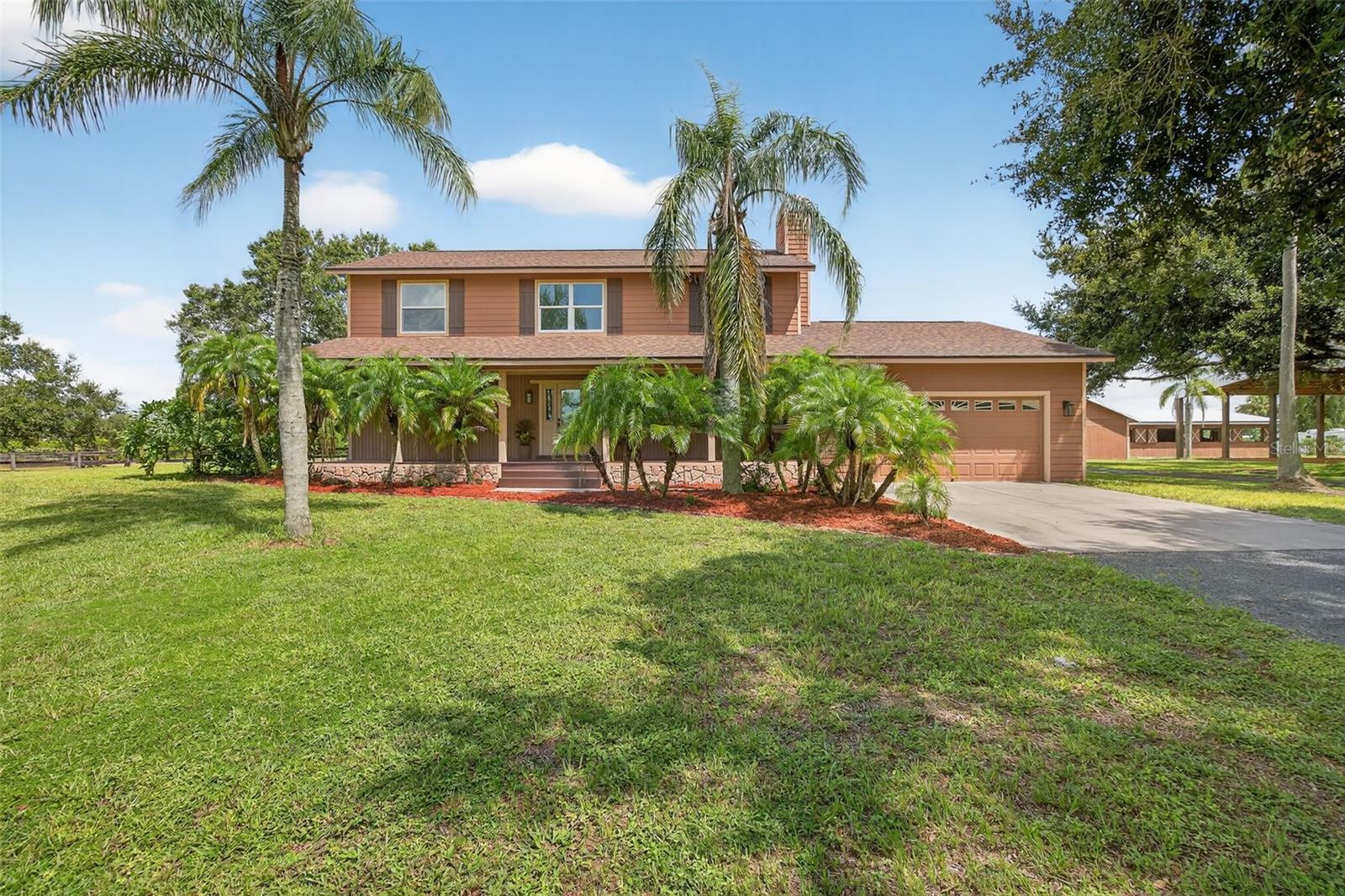 Welcome to this beautifully updated equestrian estate located in Westwood by Myakka Valley Ranches. Nestled on 5.8 private, high-and-dry acres on a quiet cul-de-sac street, this 4-bedroom (+bonus room), 2.5-bathroom home with 2,464 sq.ft. of living space combines modern updates with country charm, offering a private pool, 12-stall barn, and covered riding arena—everything you need for both comfortable living and an equestrian lifestyle. Inside, the home features a renovated kitchen with newer cabinets, quartz countertops, a center island, and upgraded 2023 LG appliances including a microwave, dishwasher , refrigerator, and oven. Additional updates include a LG washer & dryer (2023), chimney renovation (2023), utility room and half-bath renovation (2023), and new upstairs carpet (2024). Comfort is assured with two Lennox A/C systems installed in 2023, with a Haylo air purifier downstairs, plus a new water heater (2025) and water treatment system (2022). The exterior has been extensively upgraded in 2023 with James Hardie cement siding, fascia and soffit, impact-resistant windows and doors, exterior paint, and a brand-new shingle roof (2022). The backyard oasis includes an inviting pool with a rock formation and updated pool pump and equipment (2024). The septic system was upgraded with a new tank (2025). Horse lovers will be impressed by the 12-stall barn with a new metal roof, fascia, soffit, and electric panel (2025), plus a 4,800 sq.ft. covered riding arena completed in 2024 with clay footing. The property is fully fenced with multiple pastures, offering ample space for horses, trailers, or RV storage. Westwood is located inside Myakka Valley Ranches, Sarasota's largest equestrian community, featuring miles of accessible horseback riding trails. It also borders Myakka State Park, the largest state park in Florida. This property is just a short drive to A+ rated schools, shopping, Lakewood Ranch, and Sarasota’s beautiful beaches. Acreage in Sarasota will be priceless one day—so bring your horses, llamas, golf cart, toys, dirt bikes, 4-wheelers, RV, or boat. This land has room for it all! Host parties, ride horses, camp under the stars, or simply watch the wildlife. As an added bonus, the seller is including a home warranty with an accepted contract—providing extra peace of mind. Your life will change once you own this special property in Sarasota.