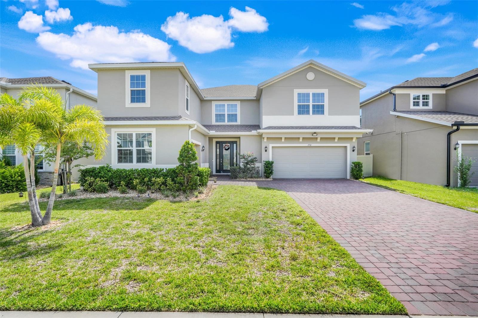 Welcome to your new home at 7740 Marsala Street in beautiful Clermont!
This expansive two-story, 5-bedroom, 3.5-bathroom home offers the perfect blend of comfort, style, and space—ideal for a growing family or anyone who loves to entertain.
As you arrive, you’re greeted by a meticulously maintained front garden and a spacious paved driveway, leading to two attached garages that can accommodate up to three cars. Step through the front door and you’ll immediately feel at home in the bright, open floor plan filled with natural light and ample space for all your furnishings and personal touches.
To your left, a formal dining room awaits—perfect for dinner parties, holidays, or everyday gatherings. The gourmet kitchen features quartz countertops, a farmhouse sink, built-in double ovens, and plenty of cabinet space, making it a dream for anyone who loves to cook. Throughout the home, you’ll also notice tastefully upgraded fixtures, adding a touch of modern elegance to every room.
The first floor also features a versatile bonus room and a dedicated office, giving you plenty of flexibility for work, guests, or hobbies. And with two separate staircases—one on each side of the home—accessing the upper level is convenient and stylish.
Upstairs, a spacious loft provides the perfect cozy retreat for movie nights or quiet evenings in. The primary suite is a true sanctuary, complete with dual walk-in closets, separate vanities, and a large walk-in shower. Additional bedrooms and bathrooms are tucked away for privacy, and best of all—the laundry room is upstairs too, right where you need it most!
Outside your front door, the community features a sparkling pool and a playground, adding even more ways to enjoy your surroundings. This home is just 5 minutes from Lake Louisa State Park, about 20 minutes to Disney, 20 minutes to downtown Clermont, and located near top-rated schools—making it the perfect location for both adventure and everyday living.
With so much to offer, the only thing missing is you—come take a look and fall in love for yourself!
