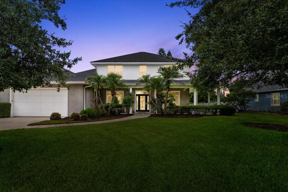 Experience the ultimate Florida beachside living in this exceptionally private almost half-acre estate, nestled in the highly sought-after Ormond Beach neighborhood. Just steps from Oceanside Country Club and a short stroll from the coveted Neptune Beach Approach, this home blends luxury living and coastal charm. The lush, tropical landscaping and stately oaks create a serene oasis, framing the property and enhancing its curb appeal. Meticulously renovated and maintained, this residence boasts vaulted ceilings, genuine wood floors, crown molding, and 5-inch baseboards throughout, all topped with a durable metal roof for lasting quality. Step inside to an open living room with soaring ceilings and a double-sided gas fireplace, providing warmth and ambiance to both the living area and the kitchen. The chef's kitchen is a standout, featuring exclusive Silestone countertops, stainless steel appliances (including a gas cooktop), and custom solid wood cabinetry. The spacious eat-in area invites casual gatherings, while one of the home's four elegant French doors opens to the breathtaking backyard an entertainer's dream with a sparkling pool, sprawling lawn, and covered lanai. The first floor is anchored by a luxurious owner's suite, complete with a beautifully updated bath featuring a freestanding tub, tiled walk-in shower, and built-in closets. Upstairs, three additional bedrooms, two baths, and a large storage area await, with one bedroom currently used as a home officeperfect for remote work or creative pursuits. Outdoor living is elevated with beautiful, timeless Sea Stone tile adorning the pool deck, outdoor living spaces, and wrap-around porches. Enjoy morning coffee or evening relaxation on any of the home's porches, each offering a unique perspective of the property and the soothing sound of nearby ocean waves. The outdoor shower adds convenience and charm after a day at the beach. This home offers the coveted proximity to the ocean-close enough to hear the waves and feel the sea breeze, yet set back to avoid the wear and tear of direct oceanfront exposure. It's an ideal retreat for those who value privacy, style, and the Florida lifestyle. Don't miss your chance to own this exquisite beachside sanctuary. Contact me today to schedule a private tour and experience this home's unmatched charm and location for yourself!