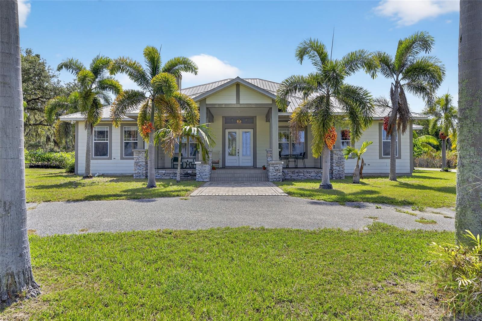 THIS IS NOT YOUR AVERAGE HOME FOR SALE! THIS INCREDIBLE PROPERTY WILL CHECK ABOUT EVERY BOX ON YOUR HOMESHOPPING WISH LIST. PERFECTLY SITUATED ON THE LITTLE MANATTEE RIVER WITH 200+ FT OF BEAUTIFUL WATERFRONTAGE WITH 80MOL FT OF RIPARIAN RIGHTS. YOU'RE FISHING TRIP OR SUNSET VIEWING IS A SHORT RIDE TO THE OPEN WATERS OF TAMPA BAY. THE ELEVATION OF THIS 4 BEDROOM 3 BATH HOME IS HIGH ENOUGH THAT FLOOD INSURANCE IS NOT REQUIRED. AND NO HOA OR CDD FEES HERE. AS SOON AS YOU PULL INTO THE CIRCLE DRIVE IT GIVES THE FEELING OF OPEN ARMS WELCOMING YOU HOME. STEP ONTO THE MASSIVE 35' FRONT PORCH THAT'S PERFECT FOR WATCHING THE SUN SET EVERY EVENING. AS SOON AS YOU ENTER THE HOME THROUGH THE DOUBLE GLASS DOORS YOU IMMEDIATELY FEEL THE OPENNESS FROM THE SOARING 12' CEILINGS. THE THREE WAY SPLIT PLAN LAYOUT OF THE HOME OFFERS A SPACIOUS PRIMARY SUITE JUST OFF THE CHEFS KITCHEN WITH AN ADJOINING OFFICE OR MAKE IT INTO A NURSERY. THE LAUNDRY ROOM AND GARAGE ARE ALSO ON THIS SIDE OF THE HOME. STEP OUTSIDE AND JUMP INTO YOUR ENORMOUS REFRESHING SWIMMING POOL THAT EVERYONE WILL ENJOY. YOU'LL WANT TO HOST ALL THE PARTIES HERE WITH PLENTY OF ROOM FOR ALL OF YOUR FAMILY - FRIENDS - AND GUESTS. DO YOU HAVE ANY TOYS OR WANT MORE - NO WORRIES ABOUT WHERE TO STORE THEM ON THIS 4+ ACRE PROPERTY! OH DID I MENTION THE TREE HOUSE!! IT HAS A WRAP AROUND PORCH!! HOW COOL IS THAT!! THERE'S SO MUCH MORE - GIVE US A CALL WITH QUESTIONS AND SCHEDULE TO SEE YOUR NEW HOME TODAY.