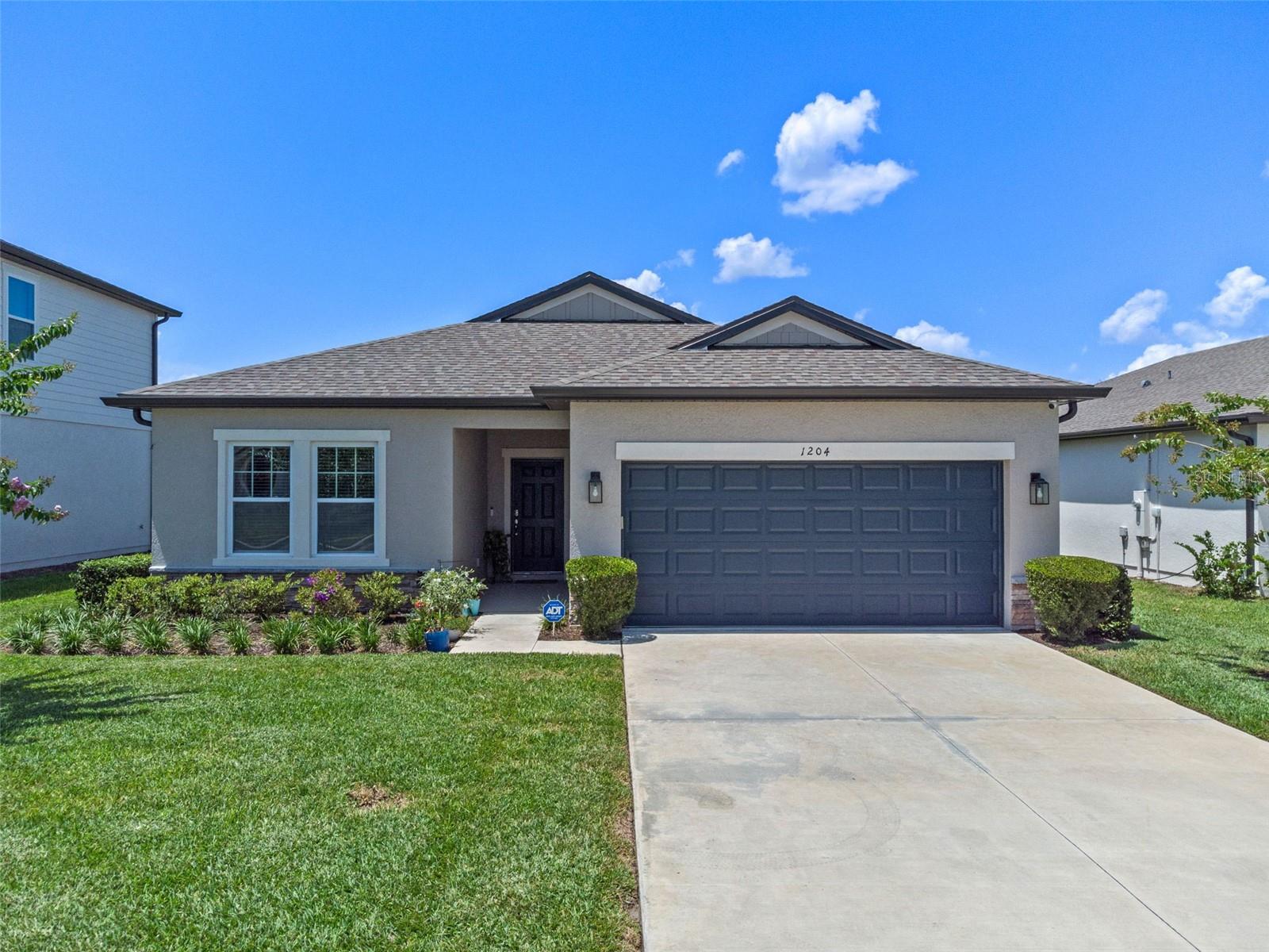 Built in 2023 by Ashton Woods, this modern home offers a peaceful retreat backing up to conservation land and a scenic pond. Start your
mornings with coffee or unwind in the evening with a glass of wine from the comfort of your screened lanai. The split floor plan provides privacy, while the open-concept living and dining area is perfect for everyday living and entertaining. At the heart of the home, the kitchen features a spacious island—ideal for hosting family gatherings. Stylish light fixtures add a sleek, modern touch throughout. Located in Deltona, Volusia County, just 25 miles from the Atlantic and conveniently positioned between Orlando and Daytona Beach, this home is perfect for those who love nature trails, community events, and a more relaxed lifestyle away from the hustle of the city.