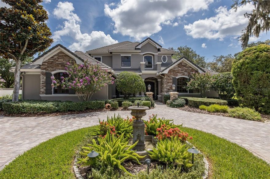 LUXURIOUS CAMPAGNA CUSTOM BUILT CHAMPIONS CLUB HOME SITUATED ON 1/2 ACRE GOLF COURSE LOT! EXPANSIVE DRIVE-WAY WELCOMES YOU TO THIS EXQUISITE HOME THAT WILL NOT DISAPPOINT! CUSTOM SOLID BRAZILIAN WOOD DOORS GREET YOU INTO THIS MASTERPIECE! FORMAL LIVING ROOM OFFERS SOARING COFFERED CEILINGS, FIREPLACE, WINE-CELLAR, TRAVERTINE FLOORS & CUSTOM CHANDELIER. EXTENDED DINING ROOM FEATURES TRAVERTINE FLOORING & BUTLERS PANTRY - PERFECT FOR ENTERTAINING. GOURMET KITCHEN BOASTS CUSTOM WOOD CABINETRY, GLEAMING GRANITE COUNTERS, TOP-OF THE LINE APPLIANCES TO INCLUDE CUSTOM RANGE, WARMING DRAWER & MIELE COFFEE MAKER! FAMILY ROOM IS ACCENTED WITH NEW STACK STONE FIREPLACE, NEWER TRAVERTINE FLOORING AND  VIEWS OF LANAI & LUSH LANDSCAPE! GAME ROOM IS EQUIPPED WITH TRAVERTINE FLOORING, WINDOW SEAT, MOVIE PROJECTOR, CUSTOM POOL TABLE & CUSTOM WOOD BAR W/RICH GRANITE! THE STUDY OFFERS TRAY CEILING, CUSTOM BUILT DESK & BOOKCASES. DOWNSTAIRS OWNERS SUITE FEATURES, TRAY CEILING W/LIGHT, WOOD FLOORS & ROOMY SITTING AREA W/GOLF COURSE VIEWS! EN SUITE BATH IS PAMPERING W/MARBLE FLOORS & COUNTERS, RELAXING TUB & CUSTOM SHOWER! HALF BATH COMPLETES THE 1ST FLOOR. CUSTOM CURVED ROD-IRON STAIRCASE LEADS YOU TO THE IMPRESSIVE 2ND FLOOR WHICH INCLUDES BEDROOMS 2,3 & 4 ALL FEATURE EN SUITE BATHS & CUSTOM CLOSETS! YOU WILL ALSO FIND A BONUS ROOM W/DOOR TO BALCONY WITH AMAZING VIEWS! SPRAWLING LANAI OFFERS HEATED SALT-WATER POOL/SPA, STONE FIREPLACE, SUMMER KITCHEN, PRIVATE SAUNA & CABANA BATH! THIS MODEL-PERFECT HOME IS TRULY ONE OF A KIND!