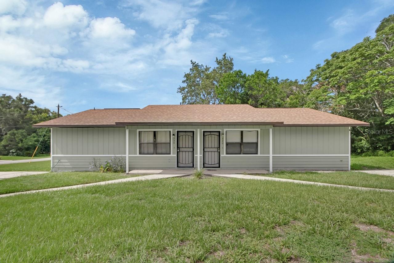 Turnkey DUPLEX Units 320 & 330 – Perfect for New Owners, Part-time residents, or Investors! This versatile duplex offers an ideal opportunity to live on one side while generating income from the other. Each unit features a spacious open floor plan with 2 bedrooms and 2 bathrooms. Situated on a 1/4 acre corner lot with No HOA, the property has been freshly painted inside and out. Both units have private 10’ x 12’ patios accessible through sliding glass doors off the primary bedrooms. Each patio is enclosed by a privacy fence and includes a gate for convenient access to the backyard and side yard. Inside, the open-concept layout includes a generous living area that flows into a combined kitchen and dining space. The kitchens are well-equipped with ample cabinetry, pantry, and plenty of countertops—perfect for anyone who loves to cook. DeLeon State Park with the charming Old Sugar Mill Pancake House is 2 miles. Downtown DeLand is just 15 minutes, and convenient shopping just 10 minutes. Ormond Beach and Daytona are just 30 minutes. For a added level of feeling safe and secure the Fire Station is just one block away. This is a rare find with excellent potential for rental income, multigenerational living, or seasonal use. Don’t miss this great opportunity in DeLeon Springs ROOF REPLACE 3/2022, WELL 4" REPLACED 2008