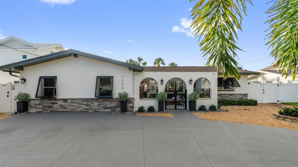 Photo of 7008 S Shore Drive S, South Pasadena, FL 33707 (MLS # TB8547512)