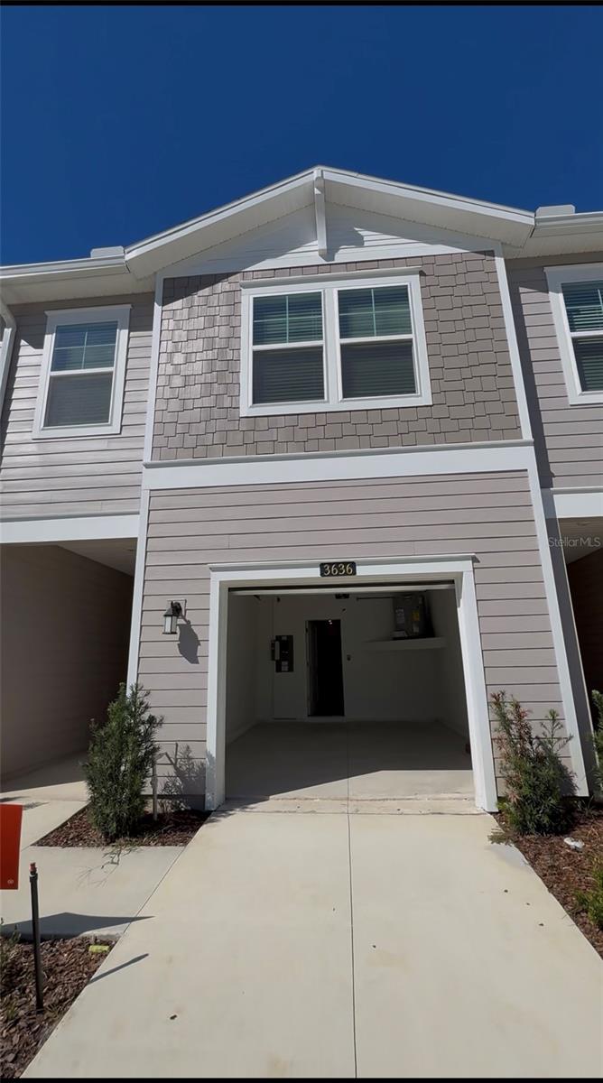 Be the first to live in this brand new townhome for rent in Oak Hammock Preserve in Ocala. This modern two story layout offers three bedrooms, two and a half bathrooms and an open concept living space filled with natural light. The kitchen features stainless steel appliances, quartz countertops, a breakfast bar and ample cabinet storage as well as a closet pantry, creating a clean and functional space for everyday living.
Upstairs, you will find all three bedrooms along with a versatile loft that can be used as an office, media space or lounge area. The primary suite includes a walk in closet and a private bathroom with double sinks and a glass enclosed shower. The laundry area is conveniently located on the second floor.
Step outside to the covered lanai to relax and enjoy the private outdoor setting. There are no rear neighbors and the property backs to a conservation area, offering added privacy and a peaceful view. Home includes an electronic lock and camera doorbell for convenience.
Oak Hammock Preserve is located near shopping, dining and major roadways, providing everyday accessibility and ease. Zoned for an A rated high school. Everything is move in ready and brand new, offering a comfortable low maintenance living experience. High speed internet included!
Schedule your showing and secure your new home in one of Ocala’s newest and most convenient townhome communities.