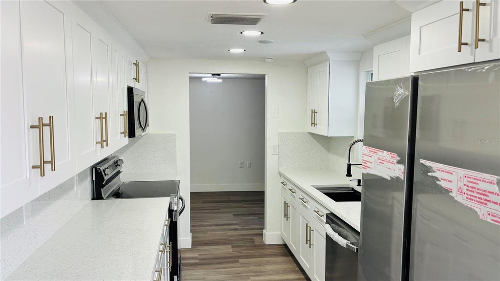 Photo of 1346 Chancellor Drive, Holiday, FL 34690 (MLS # O6436018)
