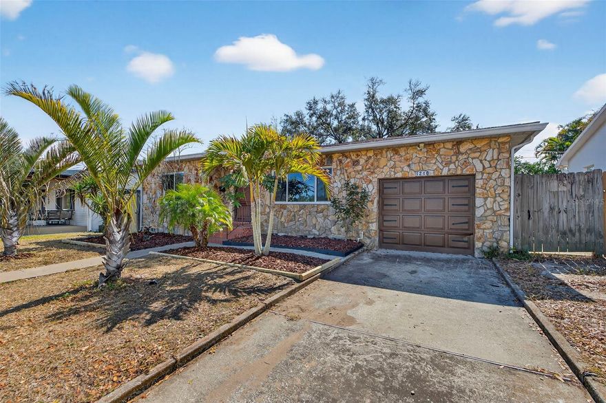 This is a rare opportunity to own a beautifully remodeled 3-bedroom, 2-bath stone home in the heart of Allendale – Monticello, one of the most sought-after neighborhoods in St. Petersburg. Situated high and dry "on the hill" this home provides peace of mind in a non flood zone. With the same timeless architectural feel as the historic Cade Allen stone homes that helped define the character of St. Pete, this home blends classic charm with modern updates in all the right ways. Over the past five years, it has been thoughtfully renovated to include new flooring, HVAC system in, updated electrical, hurricane impact windows, 2016 roof — giving you peace of mind and true move-in-ready living. The generous eat-in kitchen features soft-close cabinets and drawers, granite countertops, and flows seamlessly. The expansive primary suite is truly a retreat, complete with a stunning en-suite bath showcasing dual vanities, a frameless glass walk-in shower, and timeless subway tile, plus a custom-built walk-in closet designed to handle everything from shoes to seasonal wardrobes. The open floor plan makes everyday living and entertaining feel effortless, with easy access to the HUGE backyard. Plenty of room to add an in-ground pool and still have green space to spare. The oversized garage accommodates larger vehicles and offers built-in overhead storage. Just minutes from vibrant downtown St. Pete, with easy access to Tampa and the Gulf beaches, and surrounded by neighborhood parks, brick-lined streets, and mature oak canopies, this location offers that true community feel buyers are searching for. If you’ve been waiting for something unique and timeless with historic character, modern upgrades, and unbeatable location, this is one you’ll want to see.