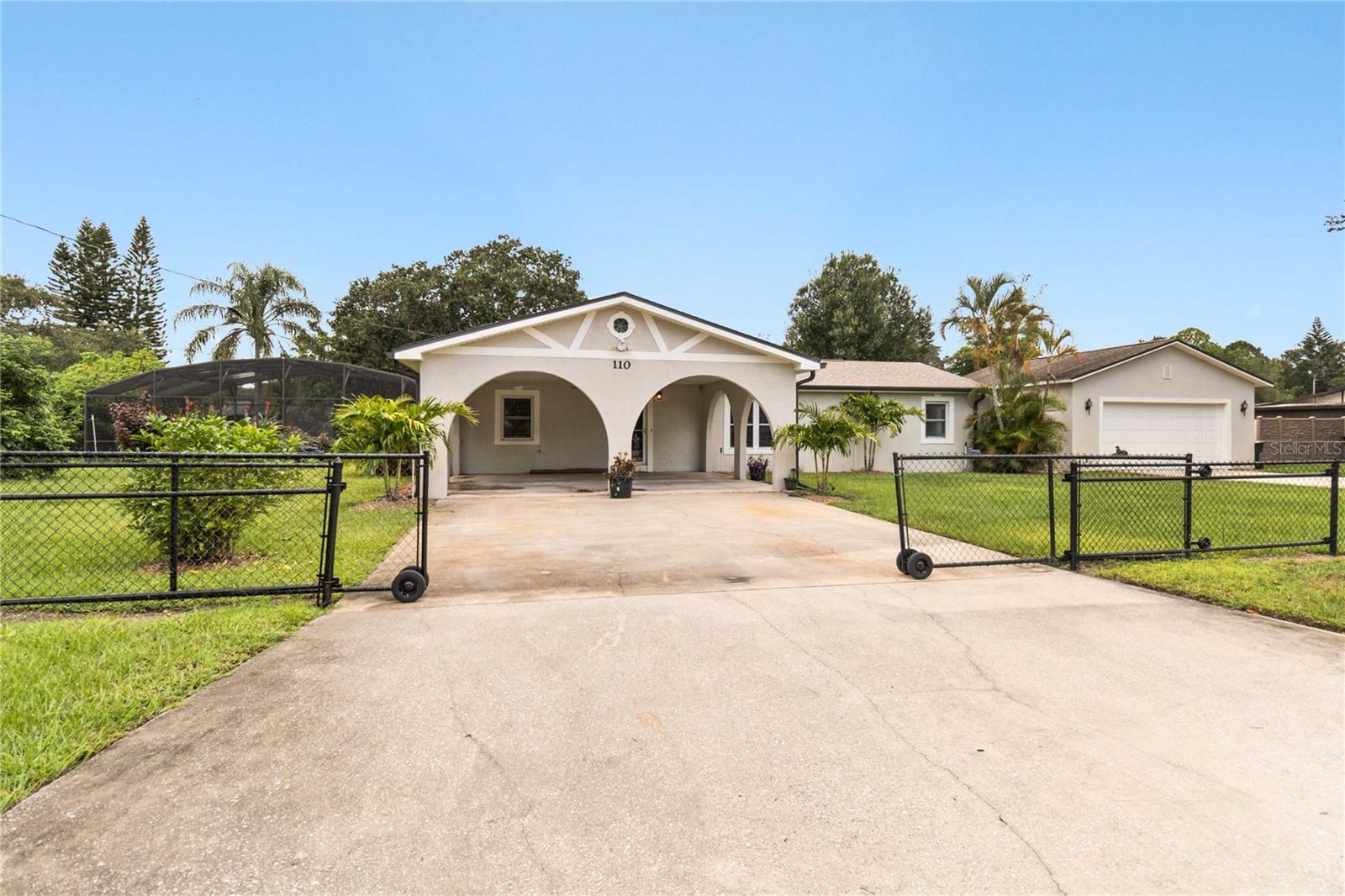 NO HOA AND NO CDD! Discover the perfect blend of comfort, space and waterfront living in this 3 bedroom 2 bath pool home close to everything. This home is situated on a double lot with a 2 car garage/oversized workshop and direct canal access (avoid the new boat ramp fees). The generous primary suite includes a private ensuite bathroom and offers a quiet retreat at the end of the day. Two additional bedrooms share a full guest bathroom perfect for family and visitors. Need more space? A large Florida room offers endless possibilities - from hosting gatherings to relaxing in the afternoon with plenty of sunshine with the multitude of windows located in this room. Open the door to unwind in your screen-in- pool, the perfect place to cool off. The canal access opens the door to one of Florida's most iconic chain of lakes- stretching from East Lake Toho to Fells Cove and Lake Ajay. New AC in 2020, New Roof in 2020 along with a new drainfield in 2024. 0 down payment financing available for those who qualify.