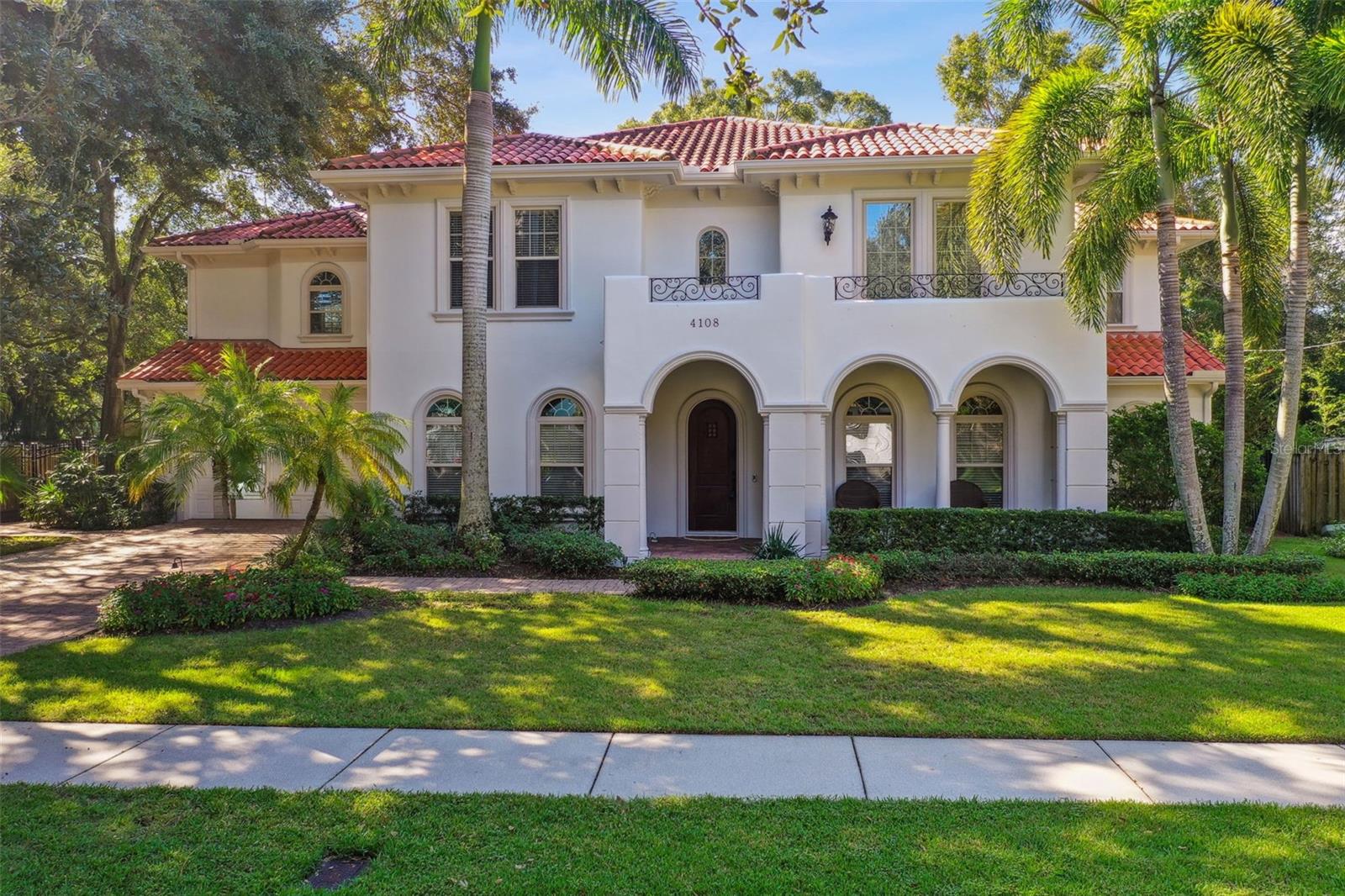 Rest easy knowing this home weathered the recent hurricane WITHOUT FLOODING, standing resilient and ready to welcome you. Experience the elegance of Mediterranean-inspired living in this stunning 4-bedroom, 4.5-bath home offering nearly 5,000 square feet of luxury living. This home offers grand living with a flex office space and a LARGE bonus space over the garage that could serve as a game room, media space or even an at home gym! As you enter, you are greeted by a grand foyer that flows seamlessly into the expansive living areas, perfect for both relaxation and entertaining. The high ceilings and abundance of natural light complement the high-end finishes throughout.
The chef’s kitchen is a true centerpiece with ample counter space and top-of-the-line appliances, ideal for preparing curated meals. Adjacent to the kitchen, the open floor plan allows for effortless entertaining, with a spacious living area that opens out to the pool and outdoor kitchen. This outdoor oasis is perfect for hosting summer barbecues or enjoying a quiet evening meal in the fresh Florida air.
The luxurious primary suite is a private retreat, featuring a balcony that overlooks the serene lush green surroundings, along with his and her closets offering optimal organization. The primary bath is designed for ultimate relaxation, complete with a garden tub, dual sinks, and elegant finishes, creating a spa-like experience right at home.
Additional features of this remarkable home include generously sized bedrooms, each offering comfort and style, as well as beautifully appointed bathrooms to accommodate family and guests. The outdoor covered kitchen and pool provide the perfect setting for enjoying Florida’s tropical climate year-round.
This home has been meticulously updated with numerous high-end features, including multi-zone surround sound system, hardwood floors upstairs (2017), a new Carrier air handler and heat pump (2017), tankless water heater and an updated alarm system (2024). The outdoor space has been enhanced with a granite outdoor kitchen, a landscape lighting and irrigation system, and pool and deck pavers.
Situated in the desirable Plant school district, this home offers not just luxury, but also an unbeatable location with top-rated schools and convenient access to all that the area has to offer.
Impeccably maintained and ready for its next owners to move in and start living the lifestyle they have always dreamed of, this home is a true gem. To schedule a private tour, contact us today! Buyer can receive a lenders credit toward buyer prepaids and closing costs (based on the loan amount) if buyer closes their loan with Pineapple Home Loans.