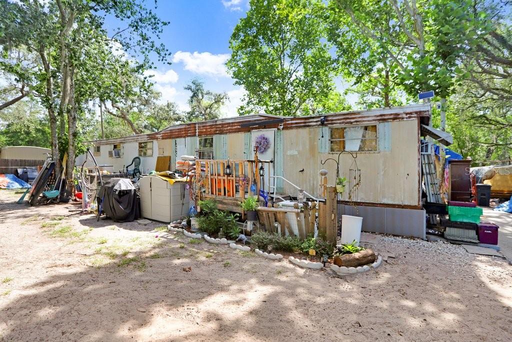Endless Potential Awaits! This 3-bedroom, 2-bath home sits on a generously sized lot shaded by mature trees, offering ample outdoor space for gardening, storage, or expansion. This property presents a unique opportunity for the right buyer to create their dream space or invest in a property with strong rental potential. Inside, the layout includes multiple living areas, a functional kitchen, and several cozy bedrooms that can easily be transformed with a little vision and creativity. Recent updates to some fixtures are already underway, providing a head start on your journey. With no HOA and plenty of space to personalize both inside and out, this property is perfect for those looking to make something their own. Schedule your tour today and imagine the possibilities!
