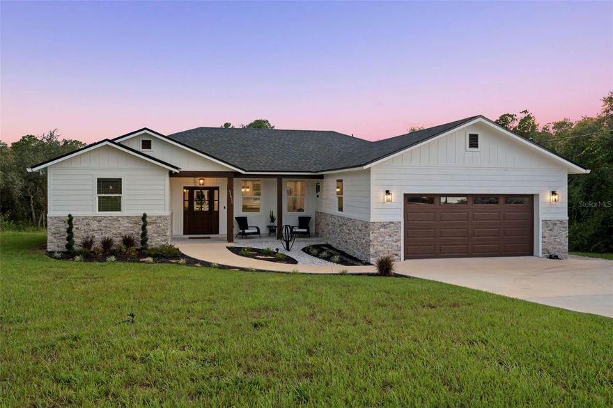 Built-in equity alert! NO HOA, NO RESTRICTIONS! This home appraised higher than list price, meaning instant value the moment you close! This well-built wood-frame home built with durable Hardie Board siding, this home offers exceptional protection and longevity. Known for its resistance to moisture, fire, and pests, hardie Board provides a low-maintenance exterior designed to last decades when properly maintained, offers excellent flexibility for future upgrades or expansions, making interior renovations easier and more cost-effective than concrete block construction. Beyond versatility, wood framing provides superior insulation, keeping the home more energy-efficient and comfortable year-round, whether in the Florida heat or on cooler days. Country living at its finest! This gorgeous home is located in Ridge Manor Estates, a quiet community in the eastern region of Hernando County—just one hour from Tampa and a little over an hour from the beaches. Nestled on 1.37 acres and surrounded by beautiful, mature landscaping for added privacy, thIs charming custom-built, split floor plan home offers 3 bedrooms and 2 bathrooms. The extended back family room adds an additional 260 sq. ft., and an oversized garage provides even more functionality.  Inside, discover an inviting layout filled with natural light and custom built-in features that add both function and style. From thoughtfully designed storage solutions to elegant details, every corner of this home has been crafted with care. The open floor plan flows seamlessly, making it ideal for both everyday living and entertaining.  This property is a true gem, offering not only a beautiful home but also an amazing 30x40 custom-built workshop right on site! Whether you’re a craftsman, hobbyist, or in need of extra storage, this workshop is designed to impress—perfect for woodworking, car projects, or creative pursuits. Bring your RV, boat, ATVs, and more—this property has the space for all your toys. Enjoy the spacious lot with plenty of room to relax outdoors, whether it’s morning coffee on the porch or evening gatherings in the backyard. Take in the tranquility of your country setting, enhanced by refreshing north winds from the Withlacoochee River, while still being within easy reach of shopping, dining, the Webster Flea Market, Ridge Manor Community Park, and more.  With this property, the possibilities are endless. Yours to enjoy as you please. Priced to sell, this is a must-see!