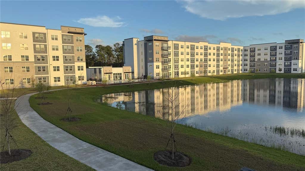 Photo of 5579 Millenia Park Boulevard #201, Orlando, FL 32839 (MLS # O6425002)