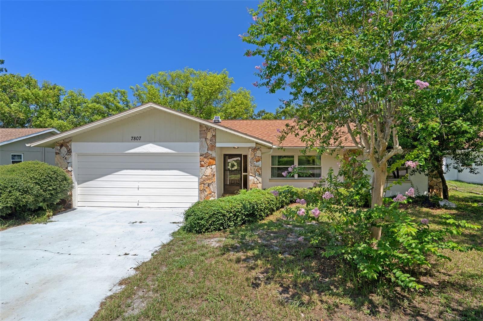 Come explore this charming home in the highly sought-after community of Lakeside Woodlands. Boasting 2 spacious bedrooms, 2 full bathrooms, and a 2-car garage, this home offers nearly 1,600 sq/ft of comfortable living space. ROOF (2019) Freshly painted inside and out (2023) As you step inside, you'll be greeted by beautiful vinyl flooring and a formal dining area that’s perfect for entertaining. The open-concept kitchen flows seamlessly into the large living room, where a striking fireplace creates a warm and inviting ambiance. The thoughtful split-bedroom layout ensures privacy. The guest bathroom has been completely remodeled with brand new tile, tub, vanity, lighting, and more! The master bedroom is spacious with a big Walk in Closet. Inside laundry room. Step outside to enjoy the expansive screened-in patio that overlooks the impressive, fully fenced backyard—ideal for gatherings, relaxation or those fur babies! Close to shopping, restaurants, and entertainment. Don't miss the chance to see this incredible home—schedule your tour today!