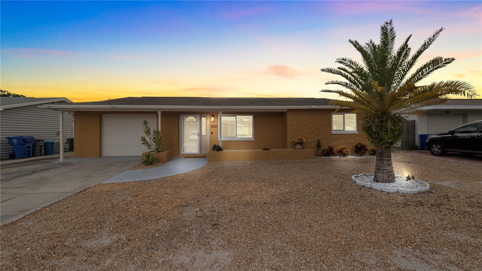 This beautiful home has 2 Bedrooms and 1 Bathroom, and also has a Playroom with a private Bathroom. Includes 1 car attached garage. New double pane storm proof windows installed in May 2022 they are nice and seem to be soundproof for now a very quiet home. Out of the Flood zone High & Dry so no flood insurance needed. In ground Pool in great shape and Crystal clear. Well kept home with a Air Conditioning system installed in Dec 2019 also a new roof will be installed in 30 days, Hot water Heater installed in 2009. Water conditioner included. Solid home and so close to parks, boat ramps and the Beaches. Resturants and the world Famous Sponge docks just 7 minutes Drive. Shopping and hospital nearby. Great opprtunity for Investement and AIRBNB.