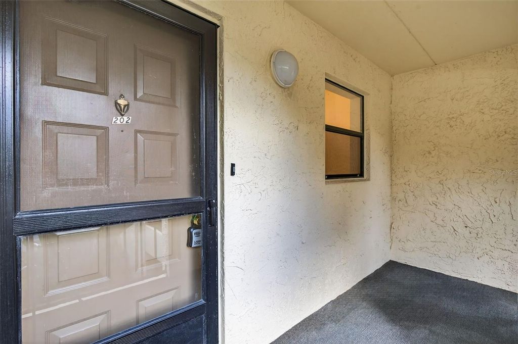 Photo of 11485 Oakhurst Road #A202, Largo, FL 33774 (MLS # TB8435378)