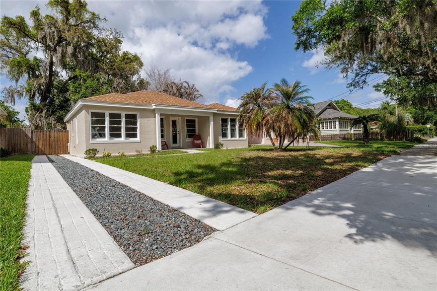 Tucked away on a charming historic brick-paver street in the heart of Thornton Park, this fully remodeled home offers a rare balance of vibrant city living and peaceful neighborhood charm, where you can enjoy the energy of Downtown Orlando while still being surrounded by tree-lined streets, scenic walks, and beautiful parks just around the corner, step inside and you’ll immediately feel the difference as natural light fills the home through beautiful windows creating a bright, airy atmosphere, this residence has been completely rebuilt from the studs out with thoughtful upgrades throughout to deliver modern comfort, efficiency, and long-term peace of mind, just minutes away from everything that makes this area so desirable including Lake Eola Park and Dr. Phillips Center for the Performing Arts along with dining, cafes, and local boutiques, featuring new framing, drywall, and fresh interior paint, updated electrical and plumbing, brand-new HVAC system plus 4-zone mini-split for individualized comfort, new roof with CertainTeed Architectural shingles (25-year manufacturer / 7-year workmanship warranty), Life proof Dusk Cherry waterproof luxury vinyl plank flooring throughout, energy-efficient JELD-WEN W-5500 windows with Sun Resist Heat Save technology, gourmet kitchen with LG stainless steel appliances, quartz countertops, tile backsplash, and upgraded cabinetry with dovetail drawers and soft-close features, recessed LED lighting and ceiling fans with remote controls, new energy-efficient insulation, tankless Eco Smart water heater, plus fresh exterior paint, new driveway, updated landscaping, and a mature starfruit tree producing twice a year, combining high-end finishes with practical upgrades in one of Orlando’s most desirable and walkable neighborhoods with easy access to parks, lakes, cafes, restaurants, and everything Thornton Park and Downtown Orlando have to offer.