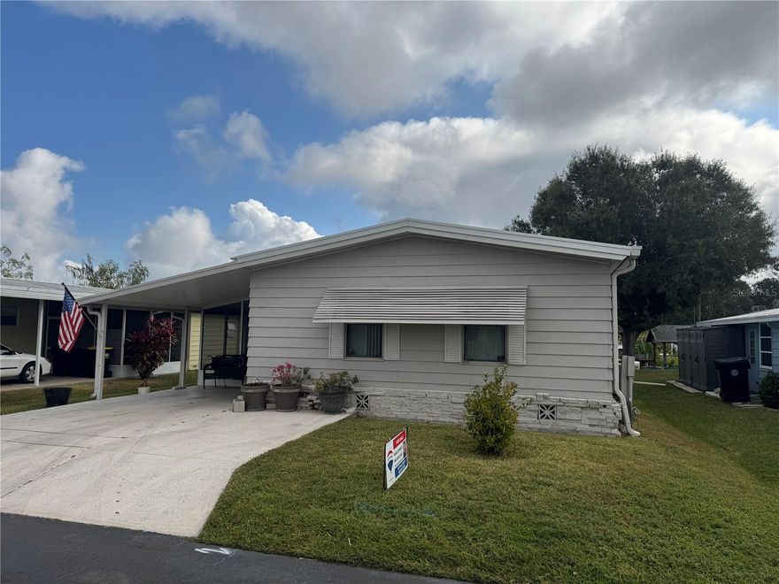 Canal front home in Lake Marianna community. NO lot rent, you own the lot.  Large primary bedroom and second bedroom has been made on the lanai overlooking the canal.  Plank flooring and neutral paint throughout.  Washer and dryer closet in second bathroom.  Good size shed/ shop area off of screened lanai.  Excellent canal front lot with seawall.