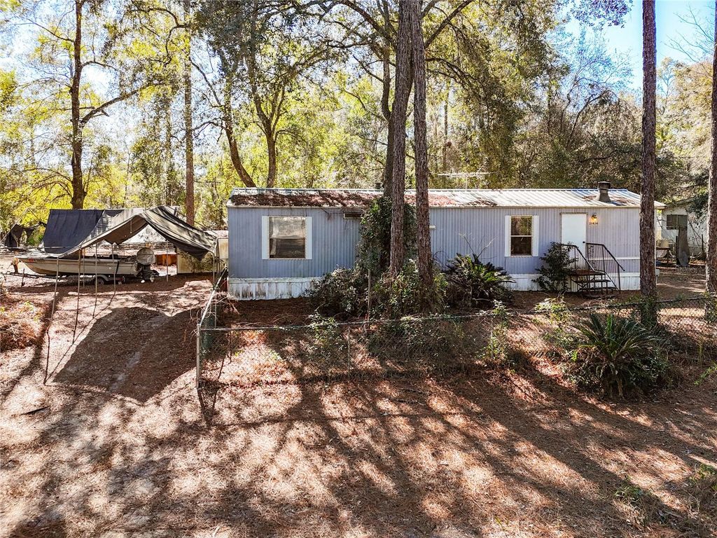 Photo of 20434 NE 143rd Place, Salt Springs, FL 32134 (MLS # OM718882)