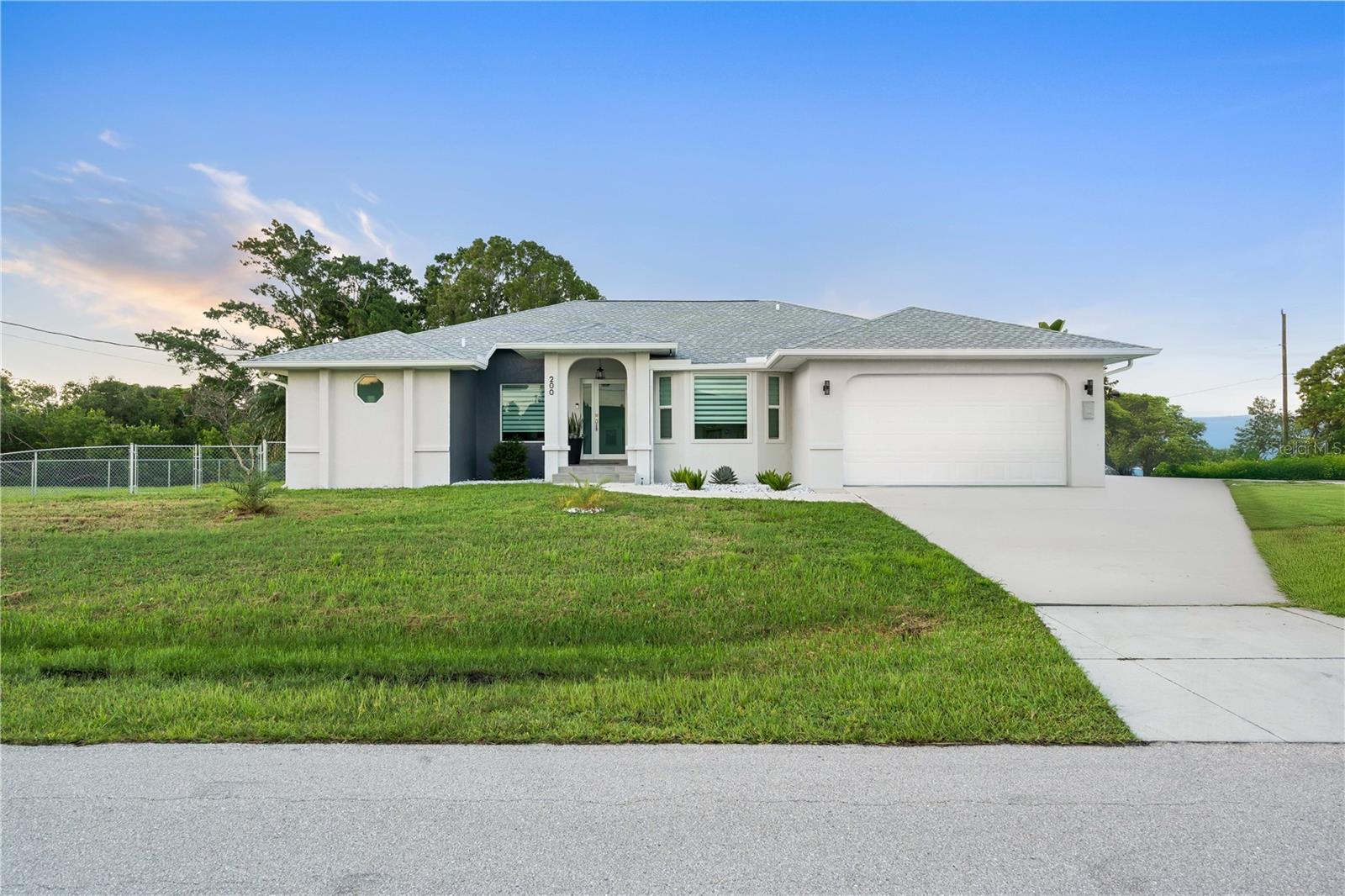 Welcome to your Dream Coastal Home in Punta Gorda!!! This newly remodeled 3-bedroom, 2 bathroom is perfectly situated in a spacious cornet lot, offers open concept floor plan with a modern kitchen designed for both style and functionality, complete with big island perfect for cooking, entertaining and gathering with the family. The kitchen also includes waterproof cabinets for durability and brand-new appliances, giving you peace of mind and touch of luxury from day one. The home has been fully renovated (except for elegant bathrooms) featuring new lighting, new A/C ducts and high-quality laminate flooring throughout. Enjoy outdoor living at its finest with the beautiful, screened terrace features sleek tile flooring, modern ceiling fan and stainless-steel cabinetry. The large sliding doors open up to lush greenery creating a seamless indoor-outdoor experience ideal for gatherings, dining or simply relaxing while enjoying the view. Step outside and find a Brand-New deck (rebuilt 7 months ago) and a private dock equipped with water, electricity, and a fish-cleaning station perfect for boating and fishing enthusiasts. From your own backyard you have access to Charlotte Harbor and the Gulf of Mexico, plus your very own fishing spot. Additional highlights include double garage, laundry area, and no HOA or CDD fees. The home sits on flood zone, but importantly, it did not take on water during 2024 and carries a very affordable flood insurance policy. Located in a quiet, walkable, well-maintained neighborhood this property offers the tranquility and convenience buyers are looking for. Here you can find a unique blend of Old Florida charm and modern convenience with tree-lined, brick-paved streets and a variety of architectural styles. Close to St. Andrews South Golf Club, the Yacht Club, Fishermen's Village, Peace River Wildlife Center, Harborwalk and the historic downtown area of Punta Gorda, you can have access to arts, community events, entertainment, fine dining and shopping. Don't miss this opportunity! Seller is motivated and is helping with closings costs. Schedule your showing today !!!