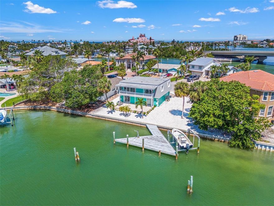 Family-owned since it was built, this home has been lovingly maintained and thoughtfully cared for over the years. This is a rare opportunity to own a distinctive residence offering 110 feet of prime waterfront, perfect for docking a sailboat or yacht. With nearly 1,800 square feet of interior living space, this home features three bedrooms, three bathrooms, an oversized garage, additional storage under the stairs, and a versatile bonus area ideal for a workshop, gym, or expanded storage. Enjoy the best of indoor/outdoor living with a spacious pavered patio on the lower level and a covered porch upstairs that seamlessly connects the living area and the primary bedroom. Start the morning with breathtaking sunrises over sparkling blue-green waters and end the day just minutes away watching sunsets at Pass-a-Grille Beach, less than two miles from the front door. The property is truly one of a kind, situated in a premier location within Vina del Mar. It rests on elevated ground next to the original Vina del Mar builder's residence, with buried power lines and open views across a large, deep-water canal in a protected basin. With zero bridge restrictions and just 2.5 miles to the Gulf, boating access to open waters is fast and hassle-free. The lot is intentionally xeriscaped with white shell and native Florida plants for low-maintenance and year-round ease. There’s ample space for kayaks, paddleboards, or canoes, and even room to add a pool. The private dock includes a 7,000 lb boat lift and a generously sized boat slip, ready for your next adventure. Just steps away is the 3.5-acre Vina del Mar community park, offering a playground, picnic pavilion with BBQ grill, a dog park, and lighted courts for basketball, tennis, and pickleball. Ready for that dream lifestyle where you can sip morning coffee with sunrise views and end the day with your toes in the sand watching a beachside sunset? This is it. Don’t miss your chance to make the ultimate lifestyle move!